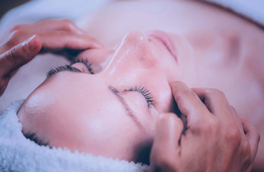 Woman getting a custom facial