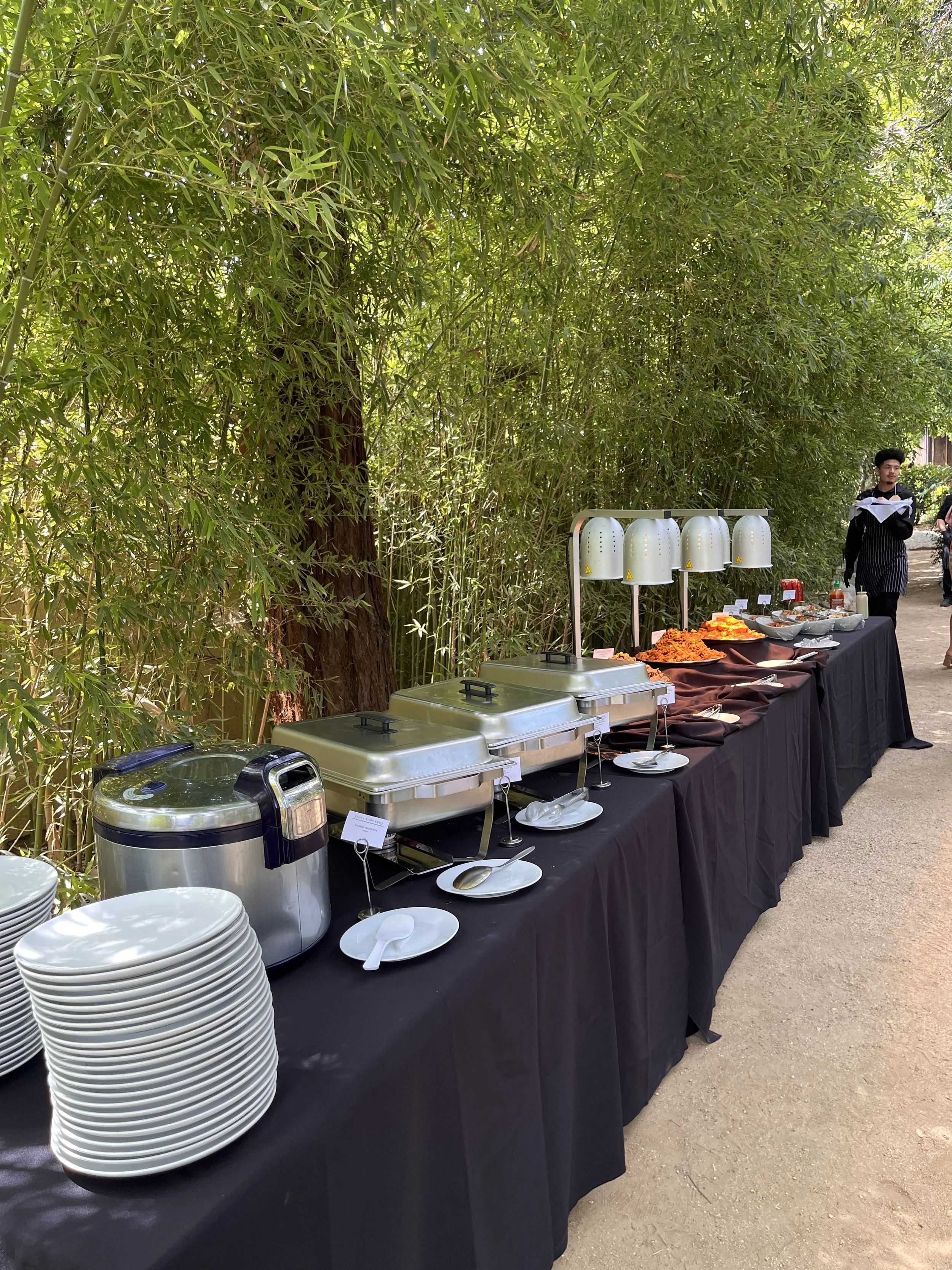 Corporate event catering featuring Korean BBQ grill masters cooking on-site in Los Angeles