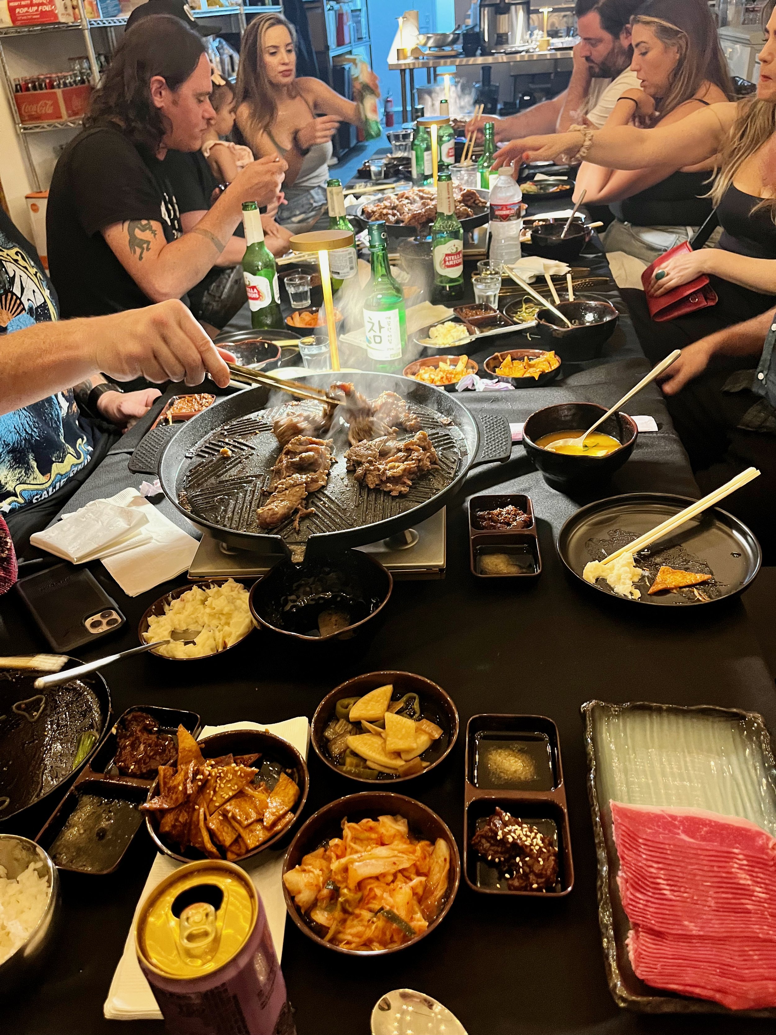 Interactive Korean BBQ table-top grilling at a birthday party catered by Seoul Food in Los Angeles