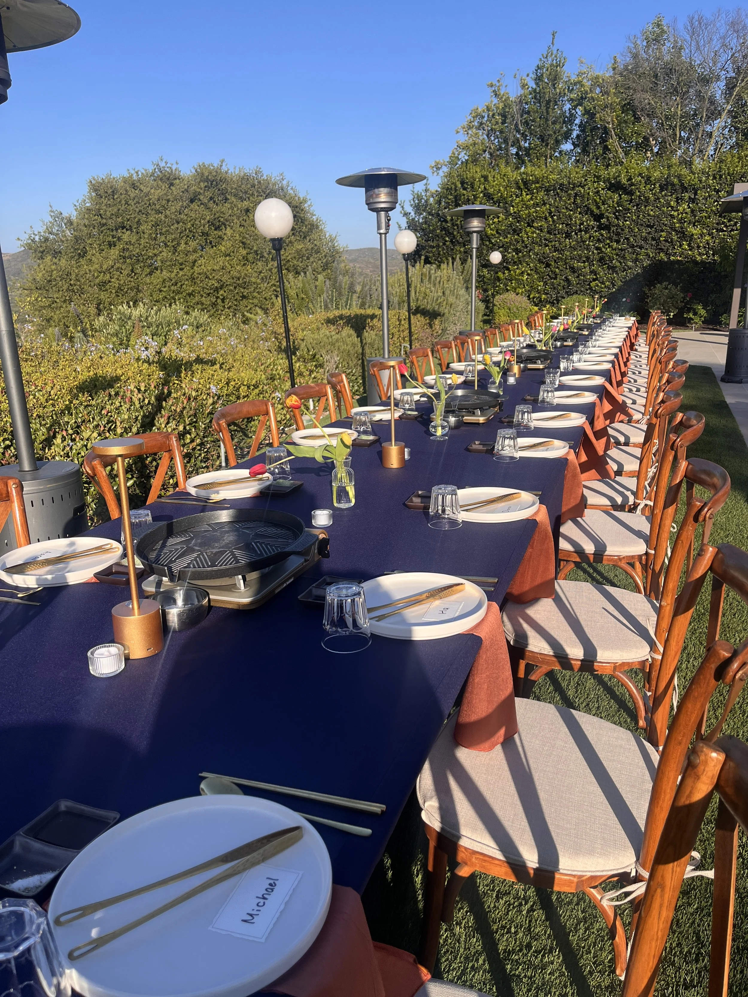 Premium full-service Korean Barbecue catering table set up with table-top grills for Korean bbq authentic experience. 