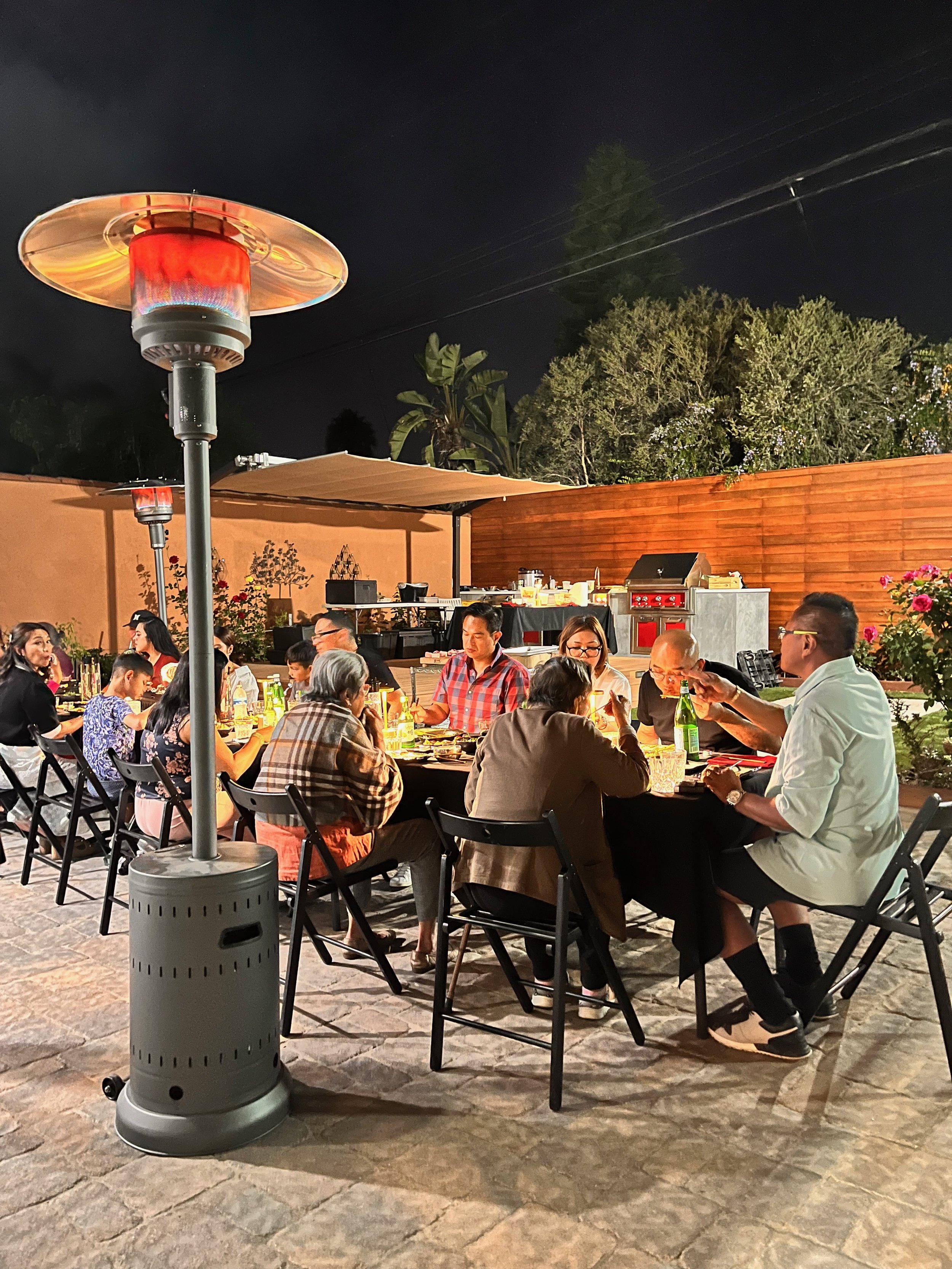Backyard Korean BBQ setup for a birthday party with live grilling and full-service catering in Los Angeles