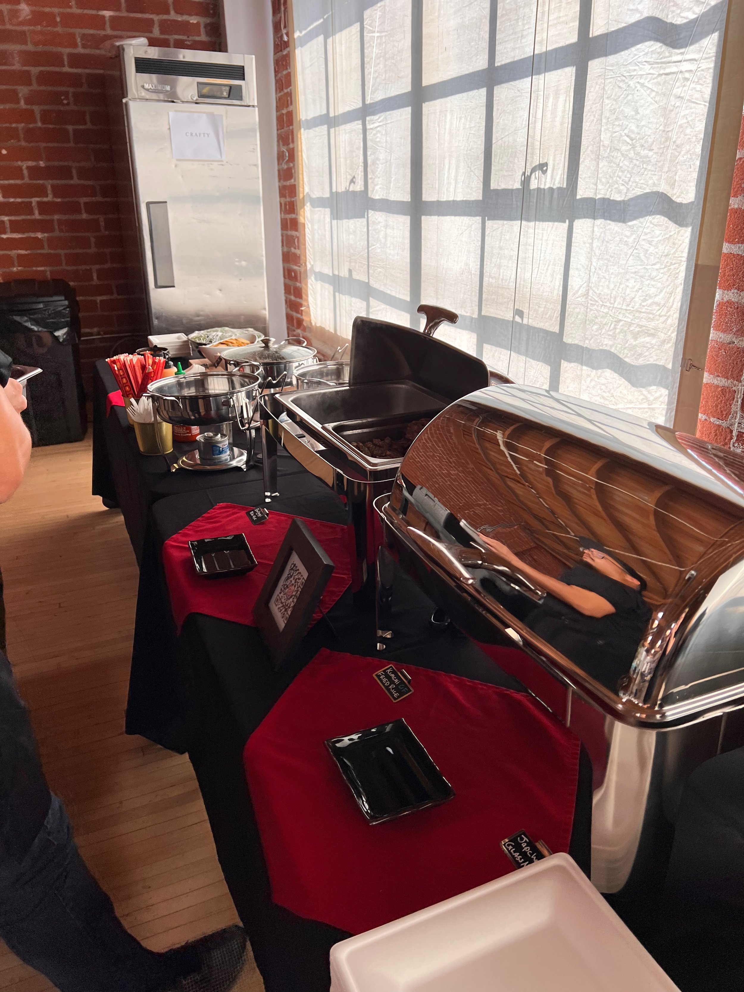 Korean BBQ corporate lunch catering setup with grilled meats and sides for a company event in Los Angeles