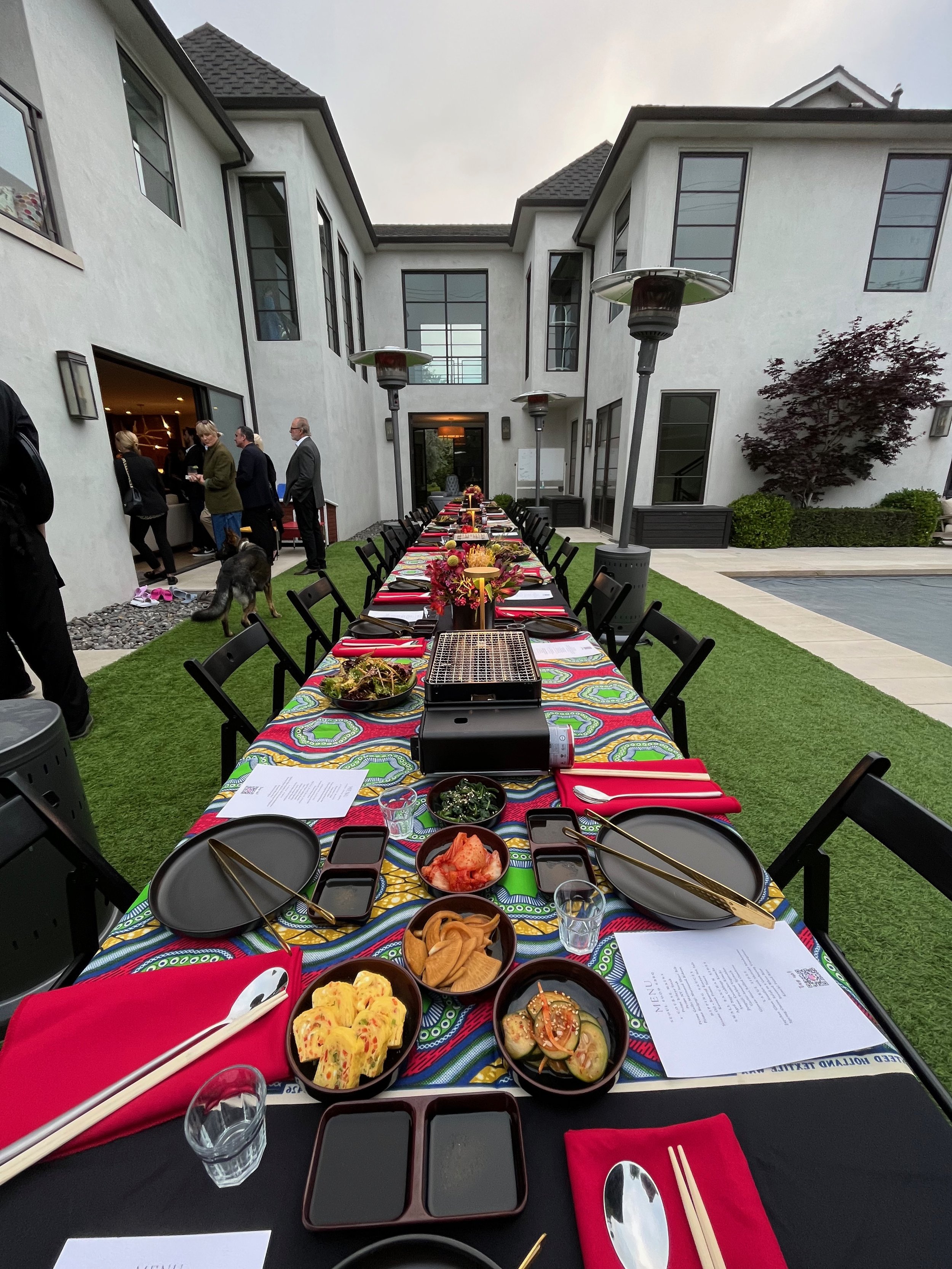 Full-service Korean BBQ catering setup by Seoul Food for a benefit event in Los Angeles, featuring buffet stations and live grilling