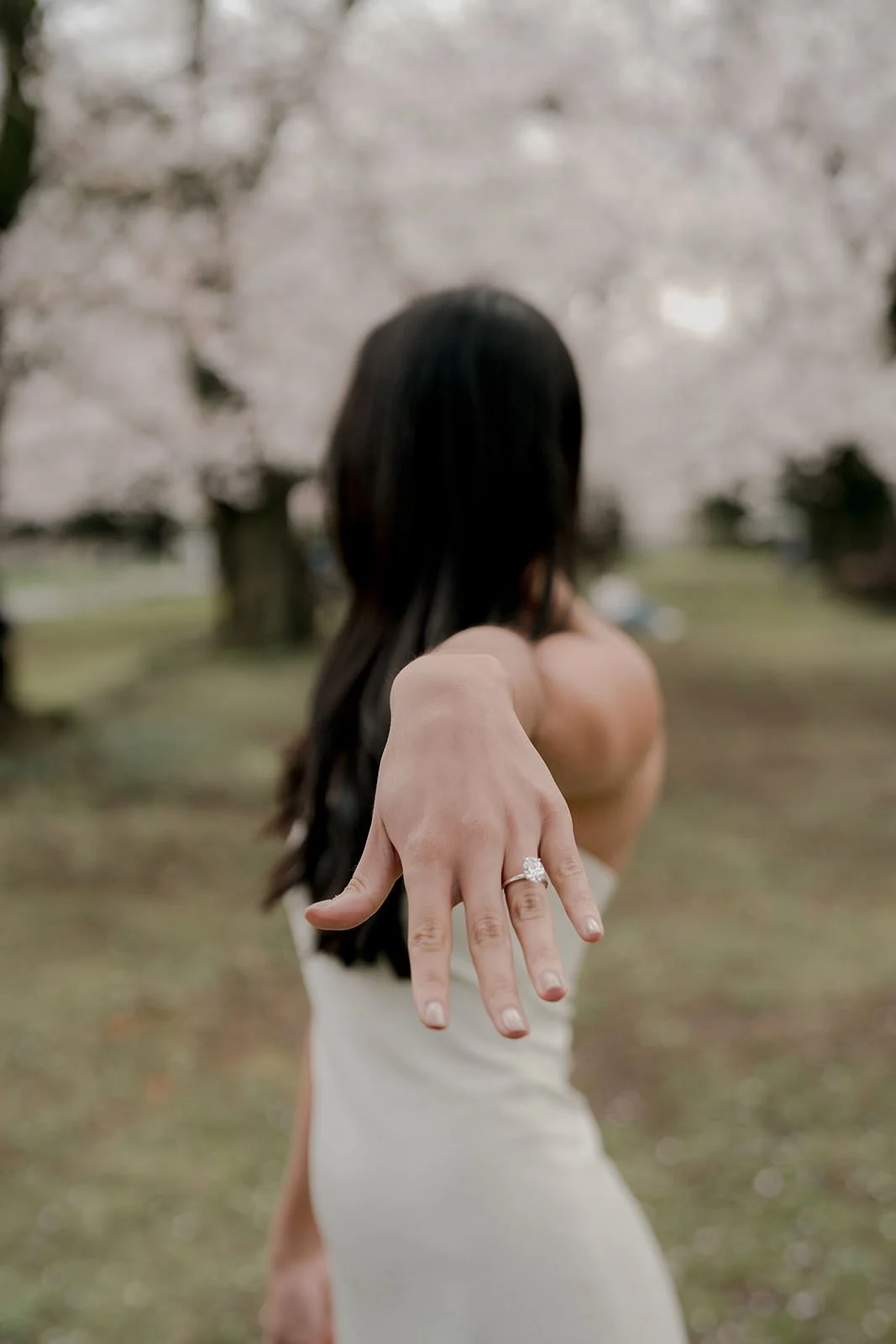 Engaged couple cherry blossom garden morning