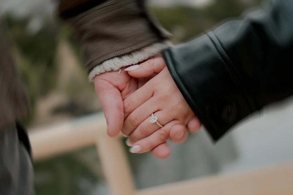 Couple embracing after proposal, Hamarikyu Gardens Tokyo