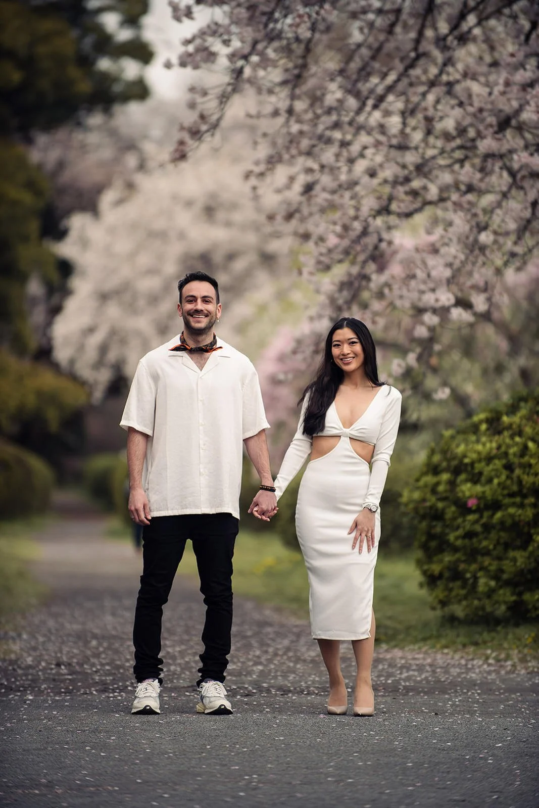 Couples photoshoot in a quiet cherry blossom garden, Tokyo, spring morning