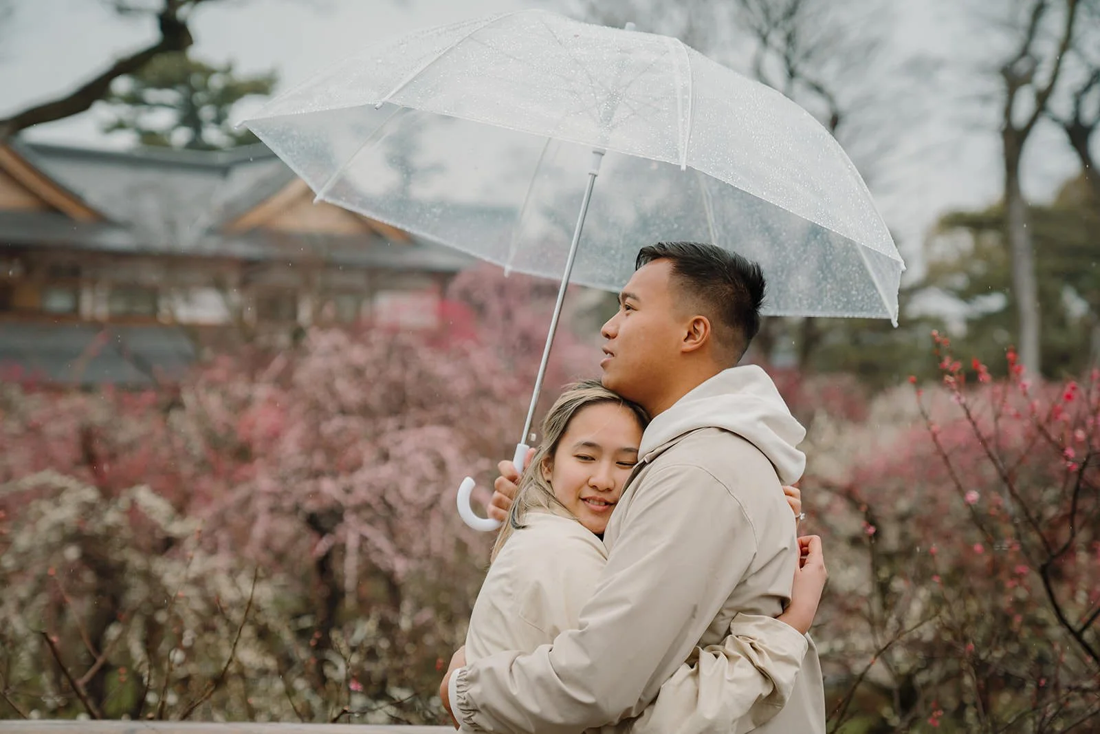 Couple walking plum grove Kitano Tenmangu rain