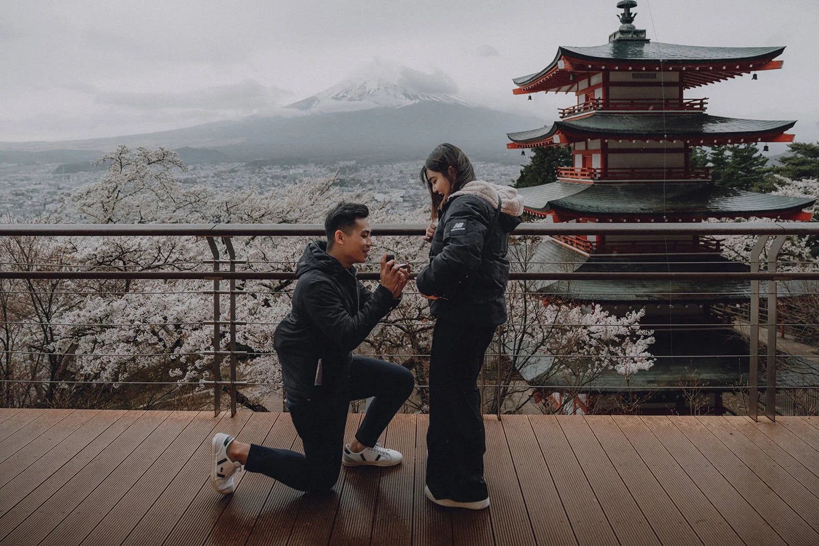 Proposal photoshoot at Chureito Pagoda with cherry blossoms and Mt. Fuji — spring morning