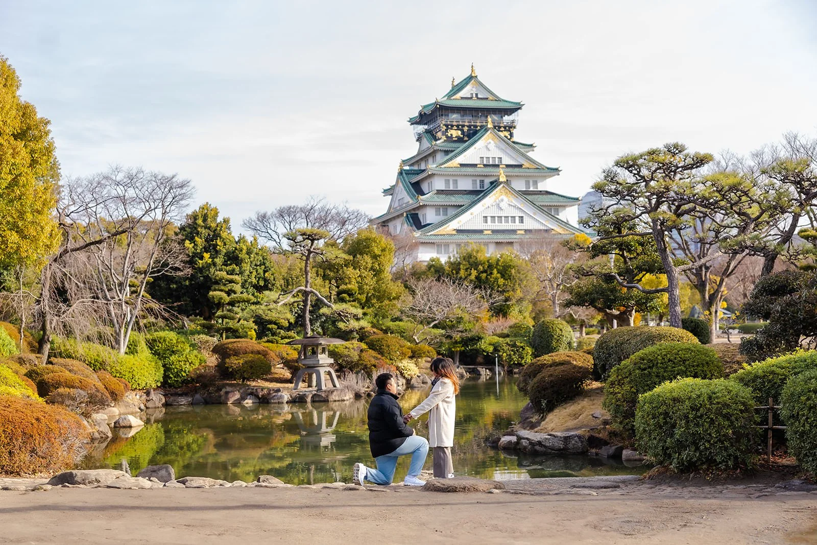 Proposal photoshoot at Osaka Castle with plum blossoms