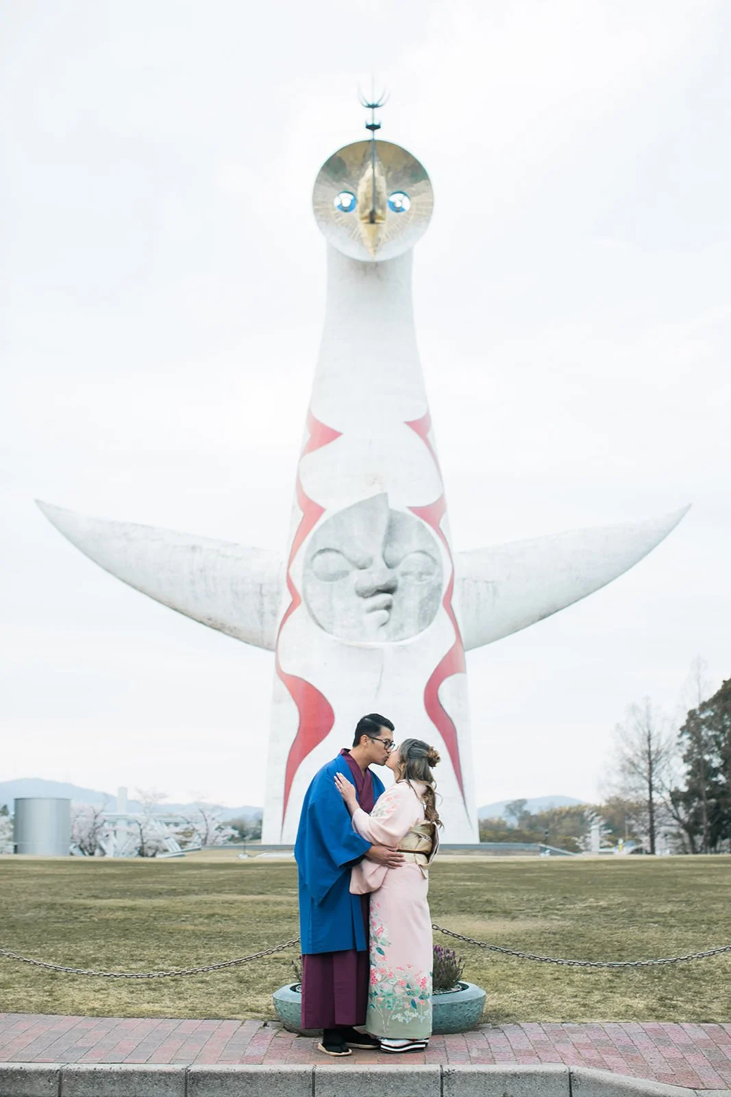 Kimono proposal photoshoot at Osaka Expo Park with cherry blossoms
