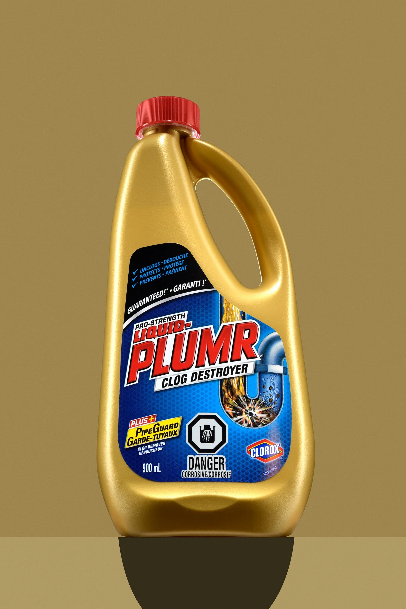 Liquid-Plumr clog destroyer bottle on gold background