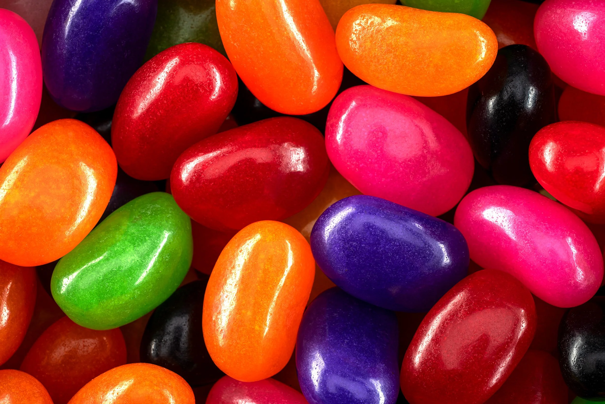 Close-up view of colorful Mondoux jelly beans in a mix of red orange green pink and purple shades