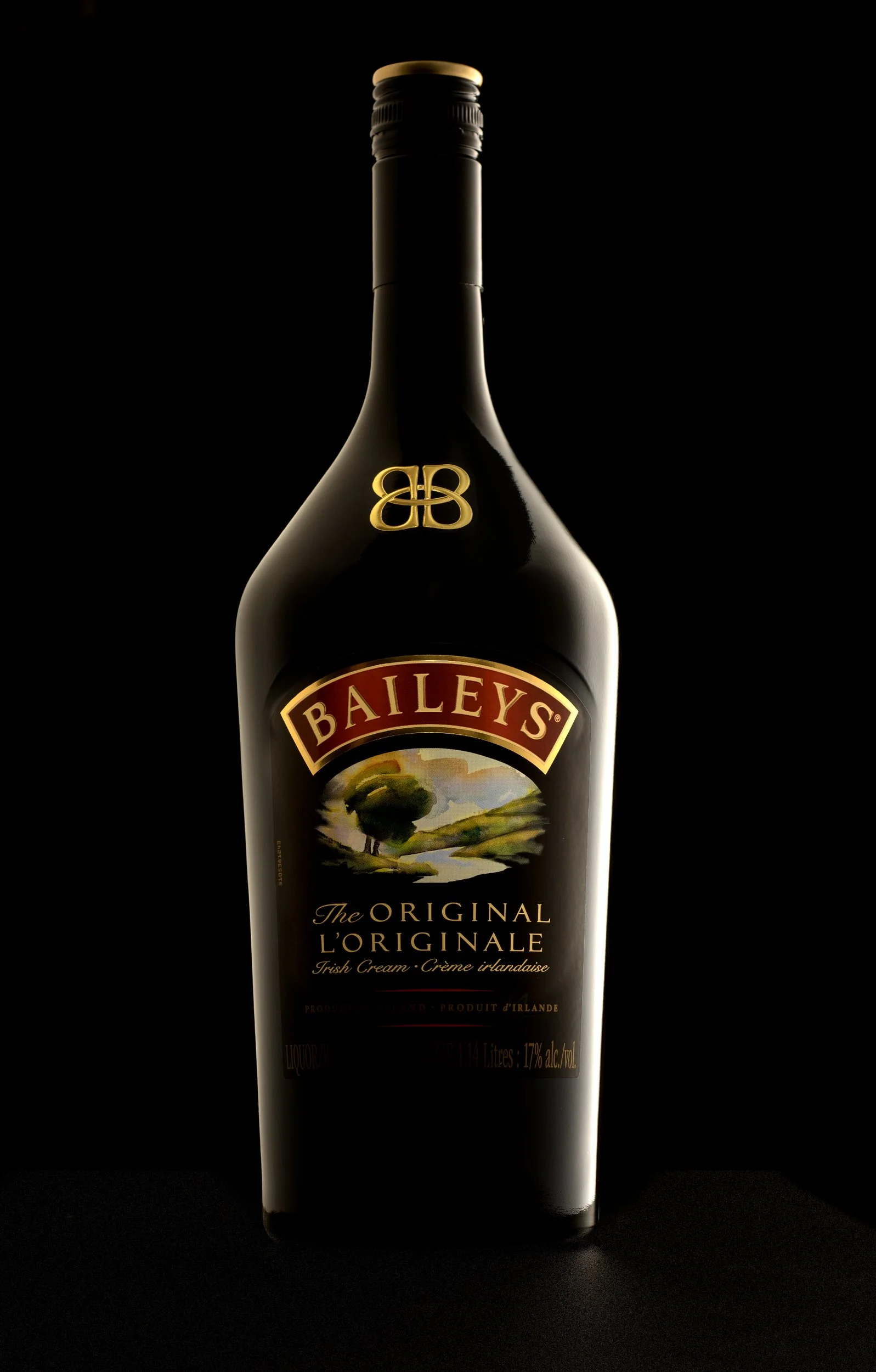 Baileys Irish Cream bottle on black background with soft side lighting