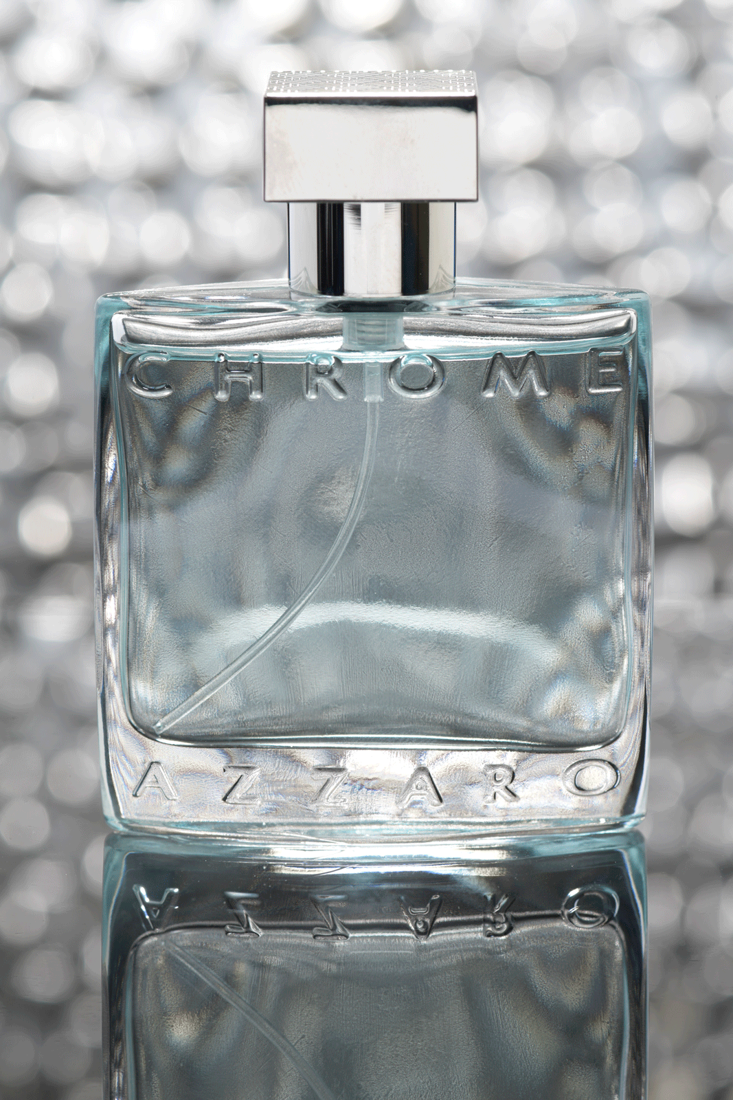 Azzaro Chrome Pour Homme Eau de Toilette on a Metallic Background