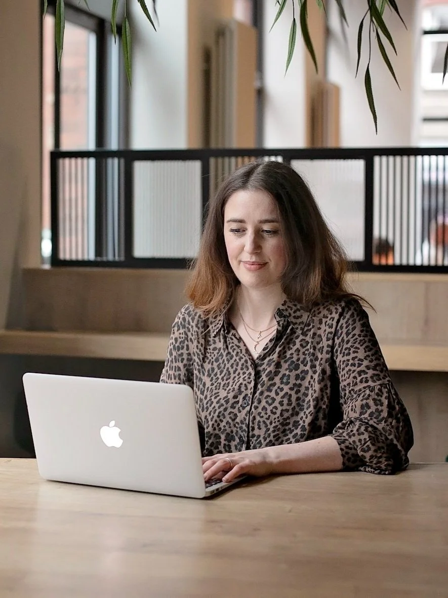 Woman-working-coworking-space-laptop