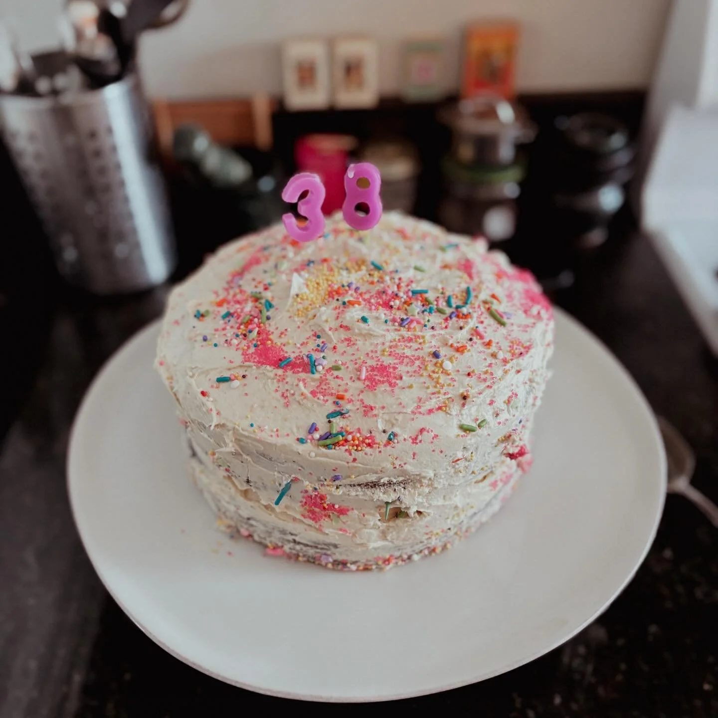 vegan chocolate cake with orange buttercream frosting for @sayerhs birthday, decorated by N and F. 🩷