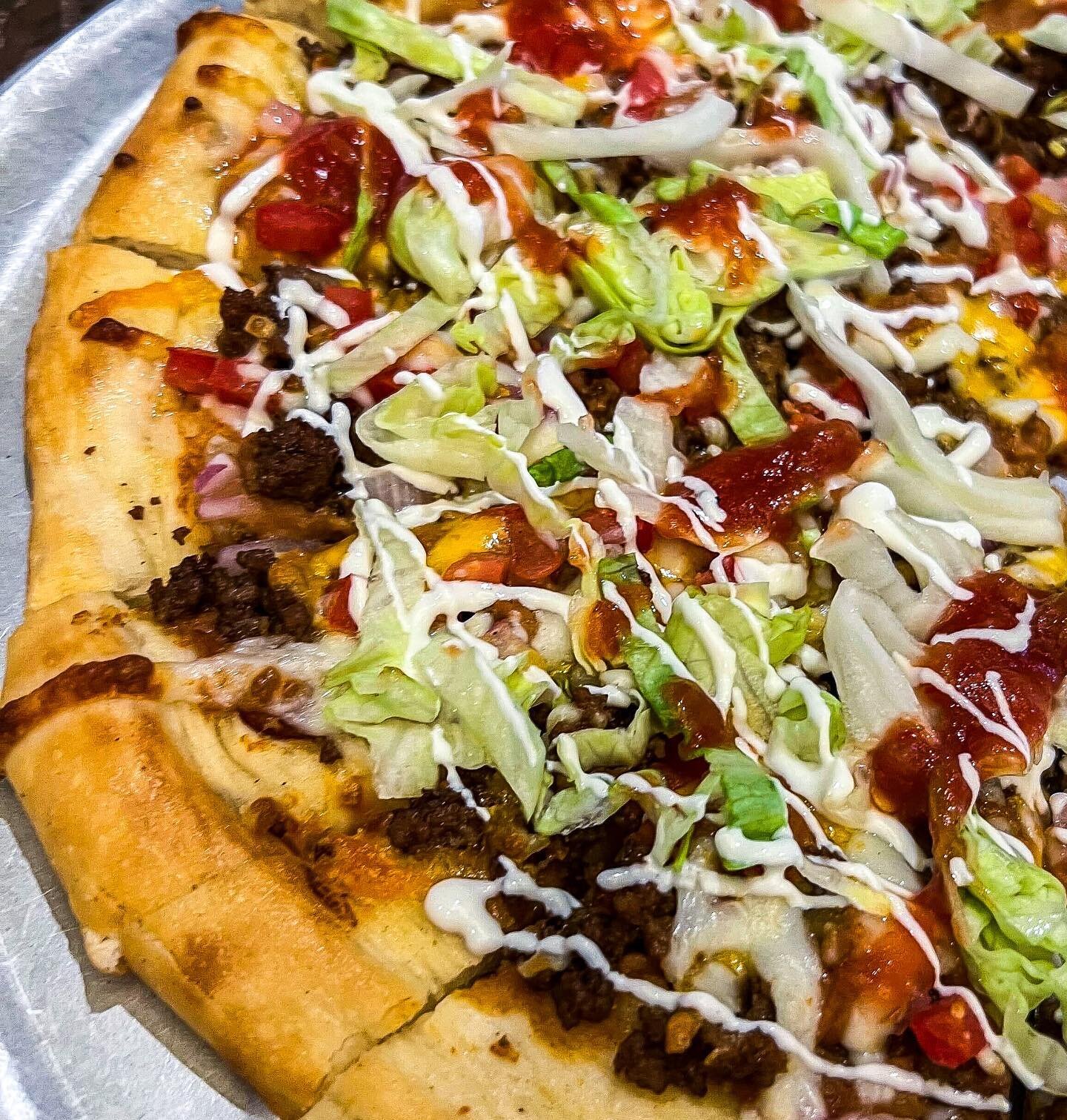 Today we are serving Taco Pizza! Hand tossed dough with refried beans, salsa, freshly shredded cheese, diced red onions, tomatoes, and taco meat garnished with shredded lettuce, sour cream, and salsa. Perfect with a strawberry margarita on the side! 