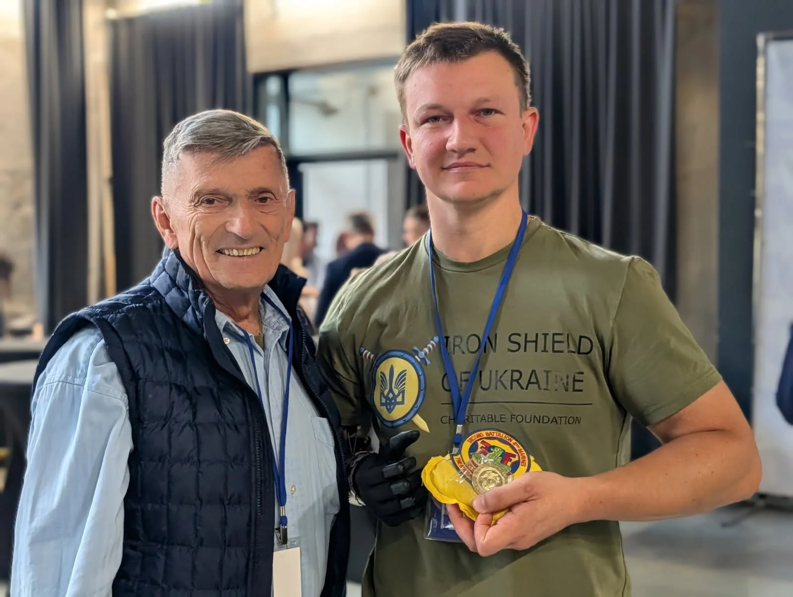 UKRAINIAN SOLDIER HOLDING LOVEY WITH HIS MEDAL