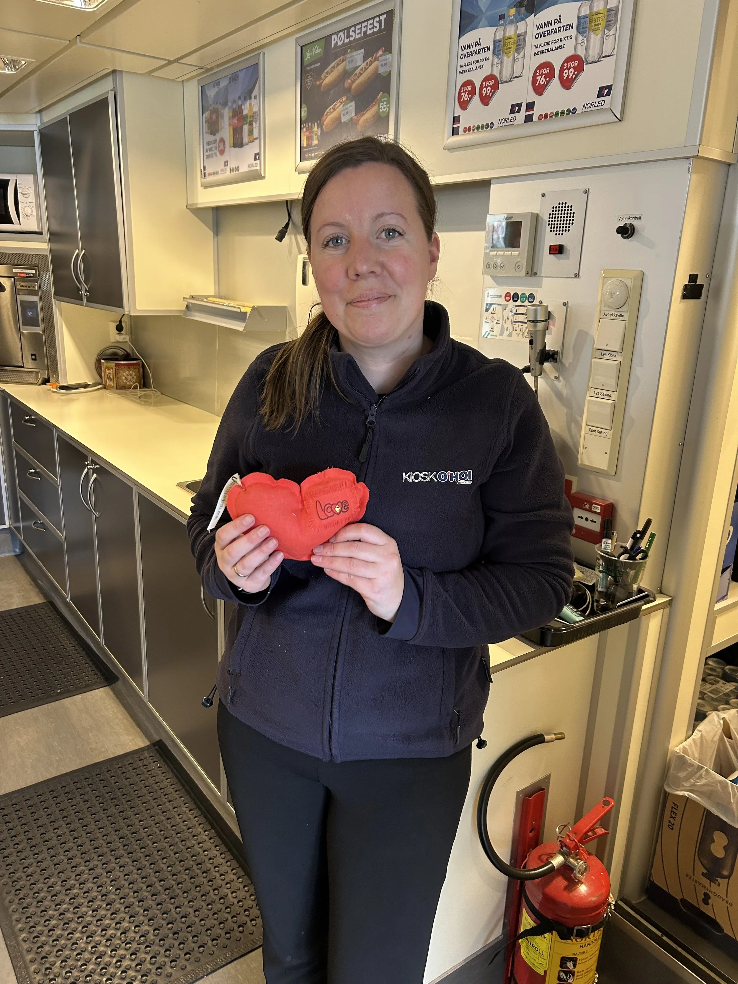 a Concession worker on a ferry through the fjords in norway