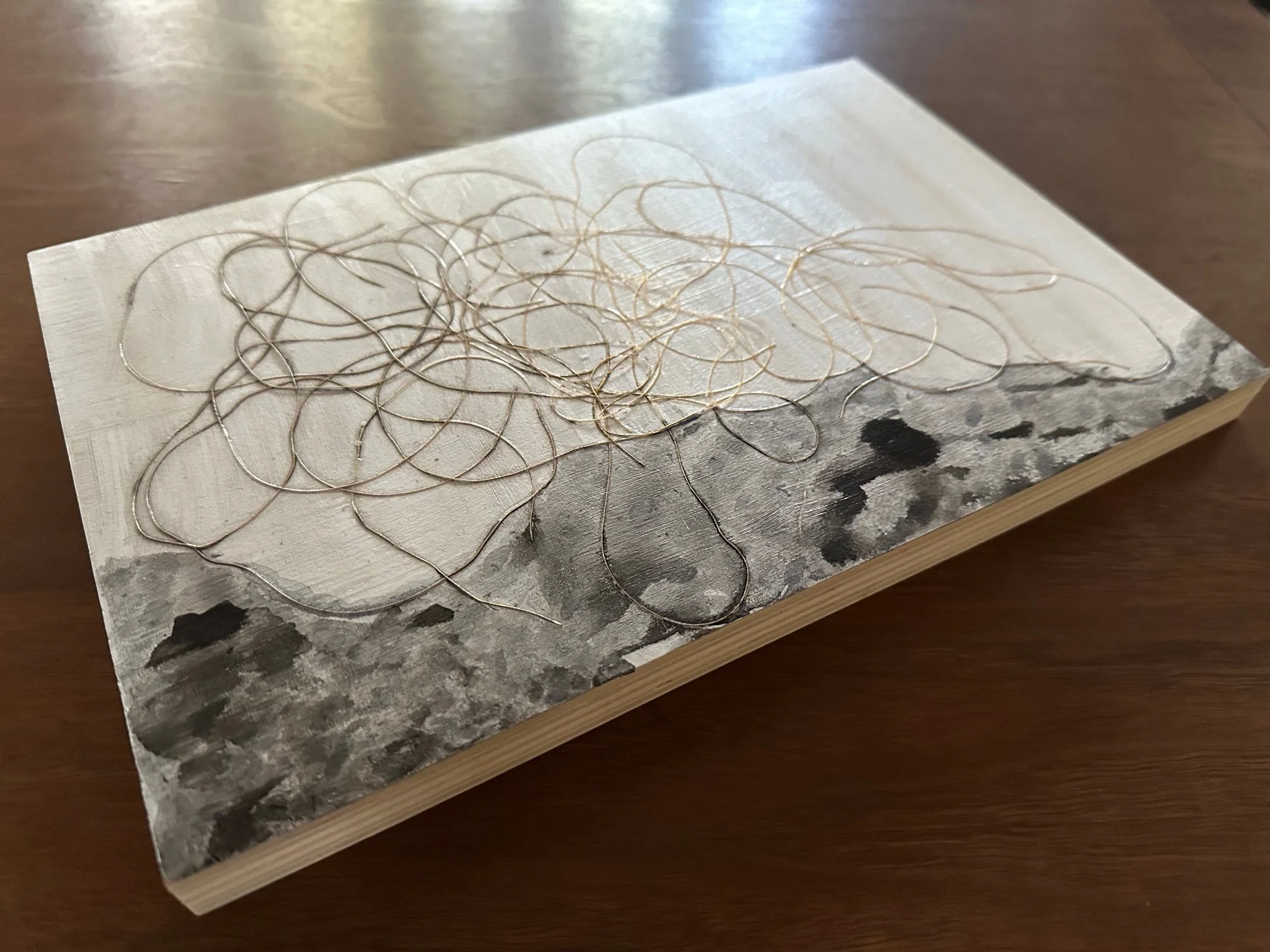 side view image of multimedia artwork by Pam Daniels called A Tangle Above
