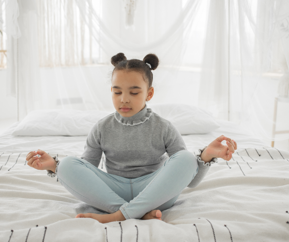 A child practicing meditation.