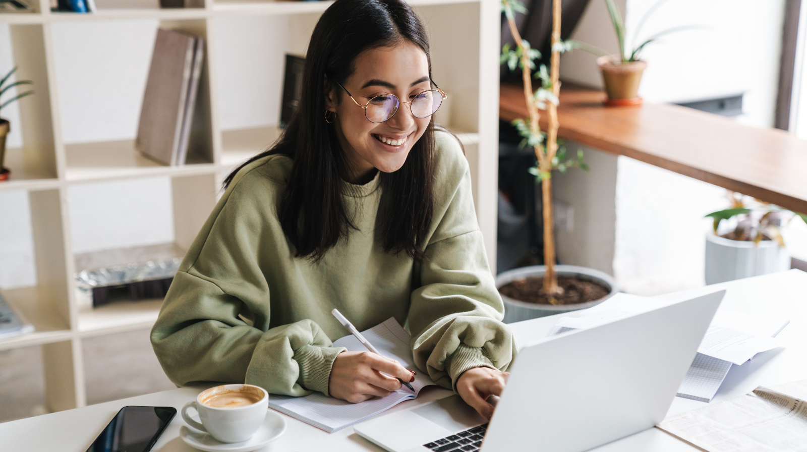Female college student with autism and ADHD participating in a virtual support group on her laptop.