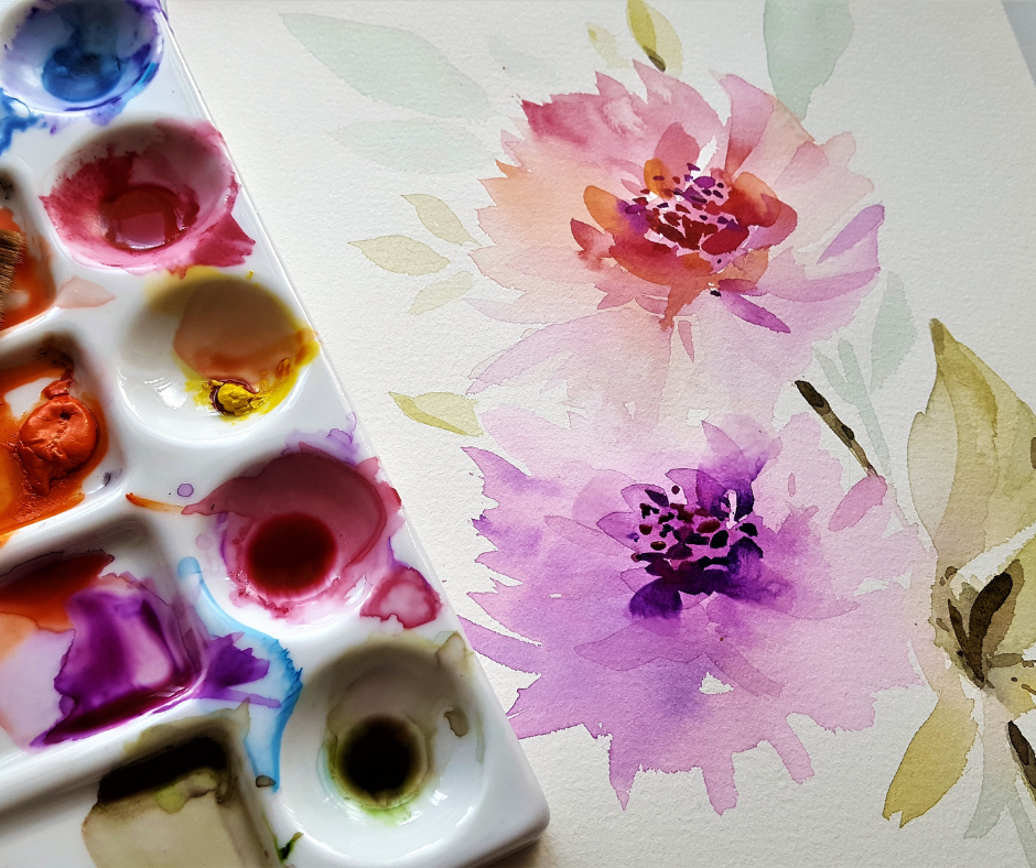 Watercolors and a painting of flowers.