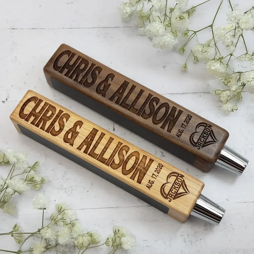 Two personalized wooden tap handles.