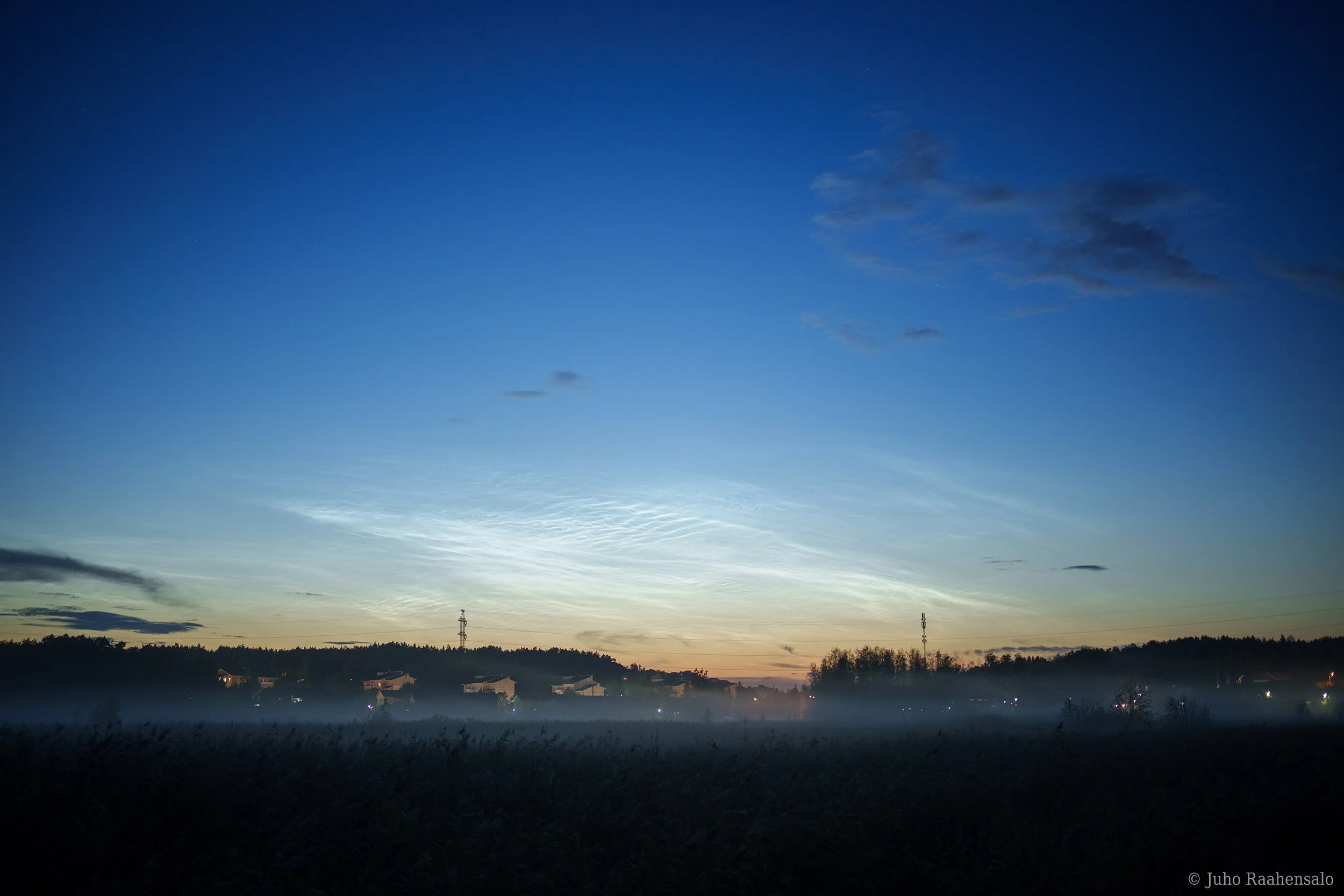 Noctilucent clouds over city