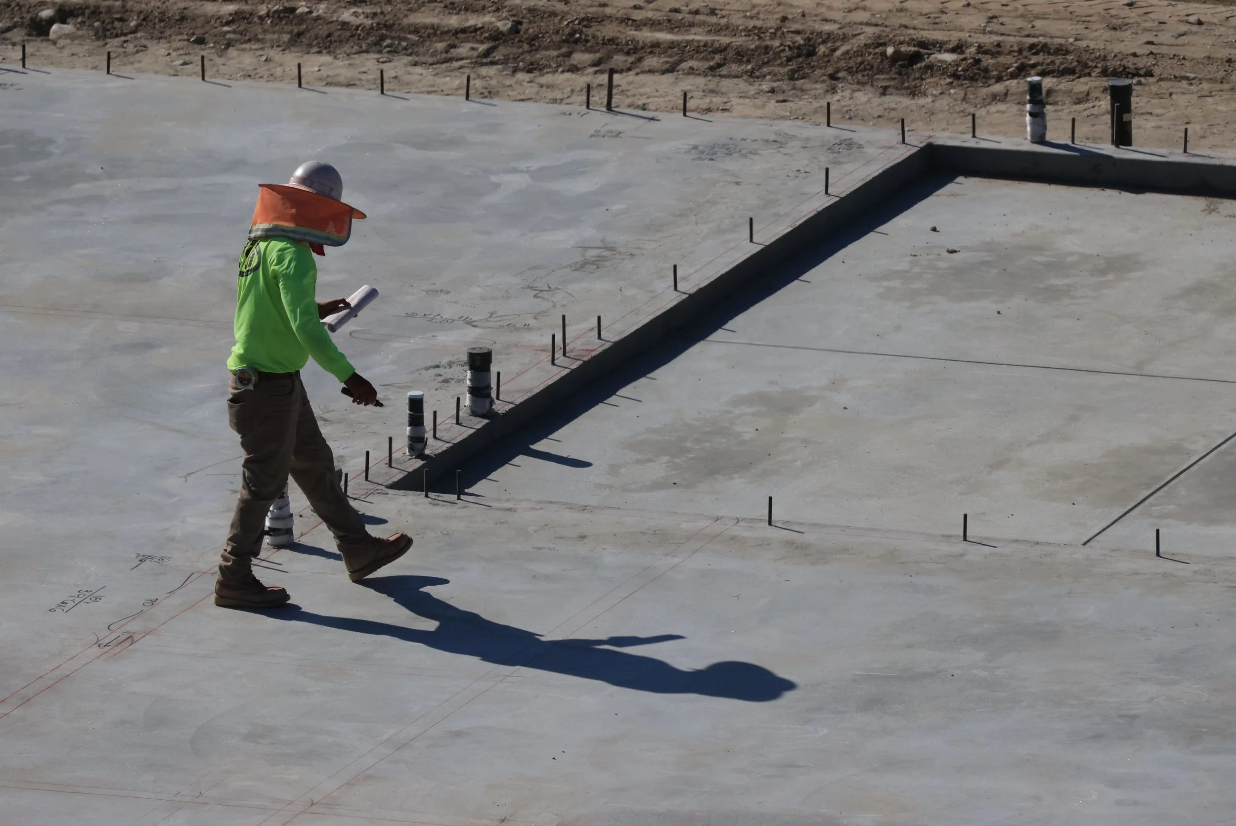Field inspector performing commercial property and construction site inspection for City Loupe field inspection services
