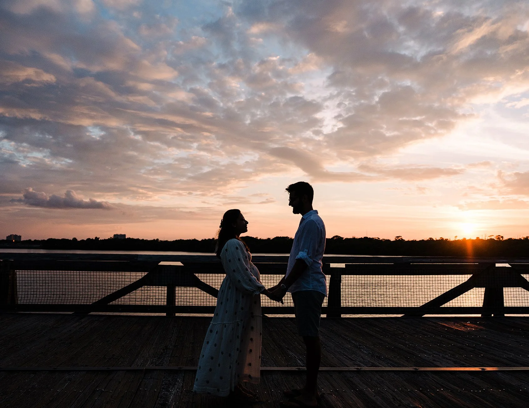 Couple during sunset maternity photo session