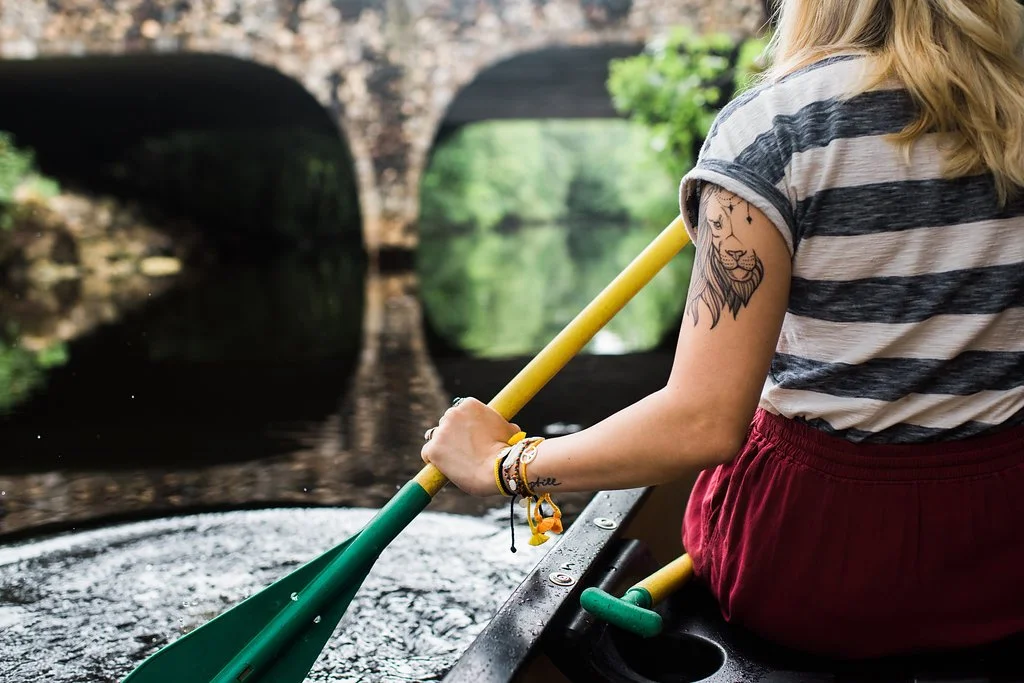 Girl paddling canoe Riverbend Park Jupiter Fl