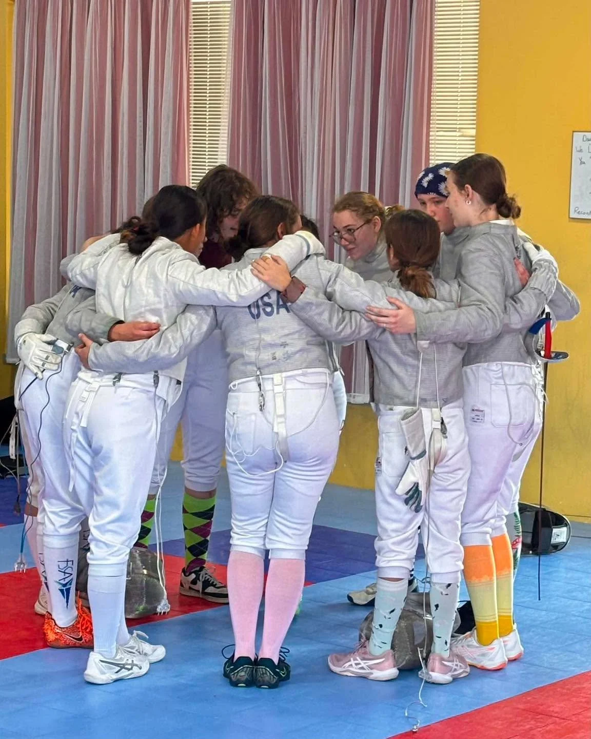Happy World Fencing Day!

For this day, we want to recognize the camaraderie on display at our August Referee Observational Tournament. 

The Fence St. Louis women and girls pulled up into a huge group huddle in the middle of their event. I was busy 