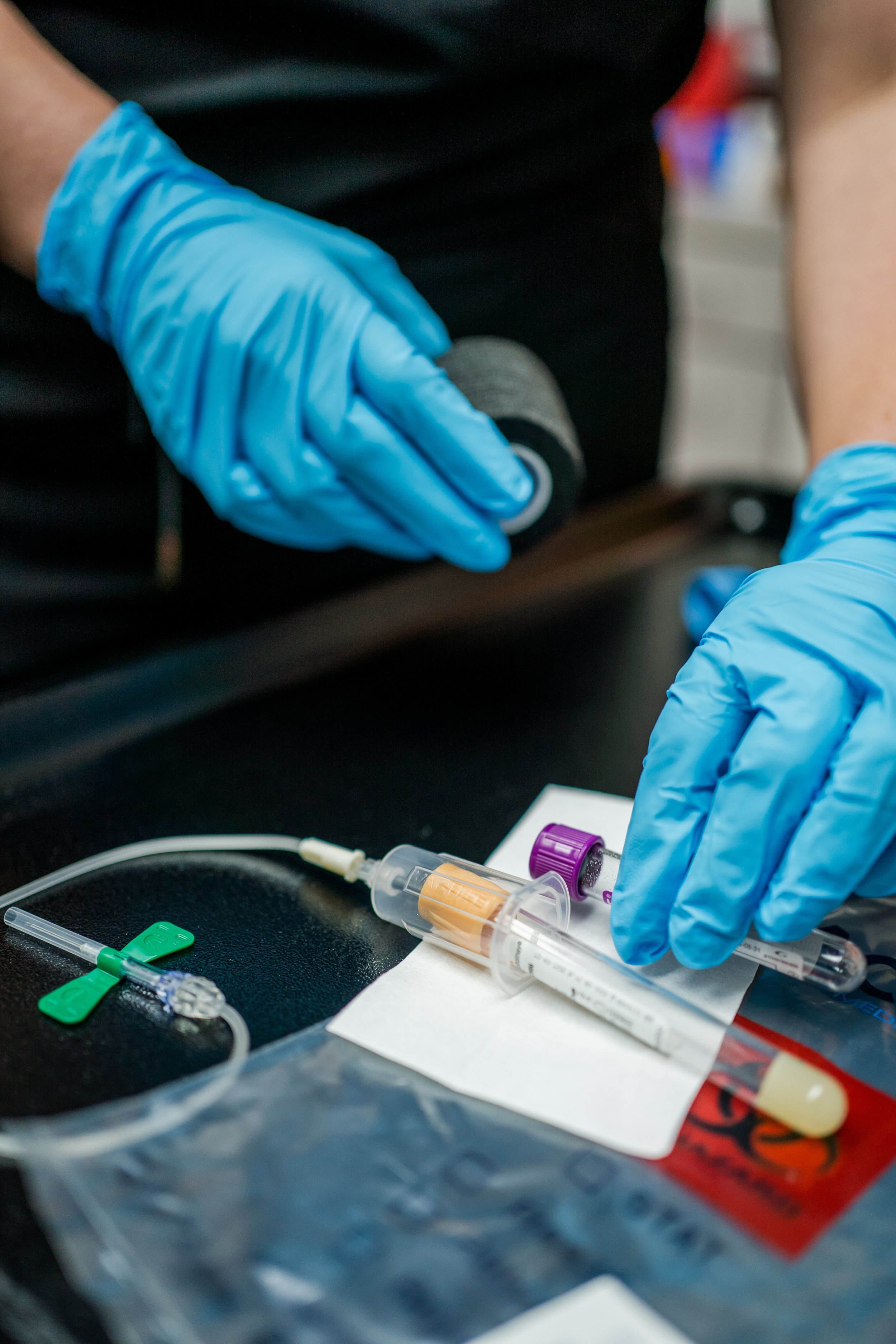 in office lab work, drawn, blue gloves, registered nurse