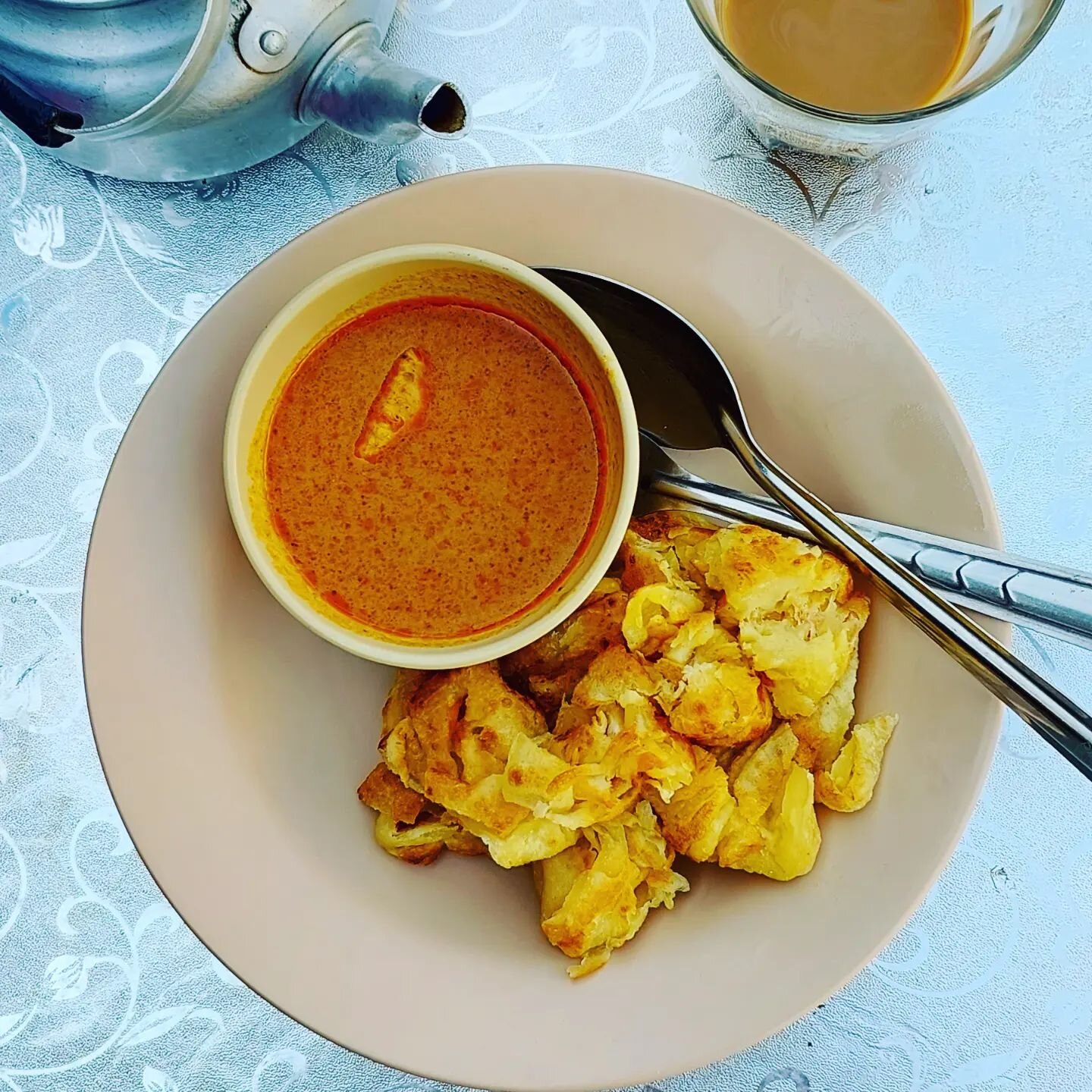 My new fave morning roti + curry hides at the back right-hand corner of Chalong's Suksamram Market, just past a pair of dueling fried chicken counters (both good) and the dried fish dude. If you hit the fresh coconut milk vendors, you've gone too far