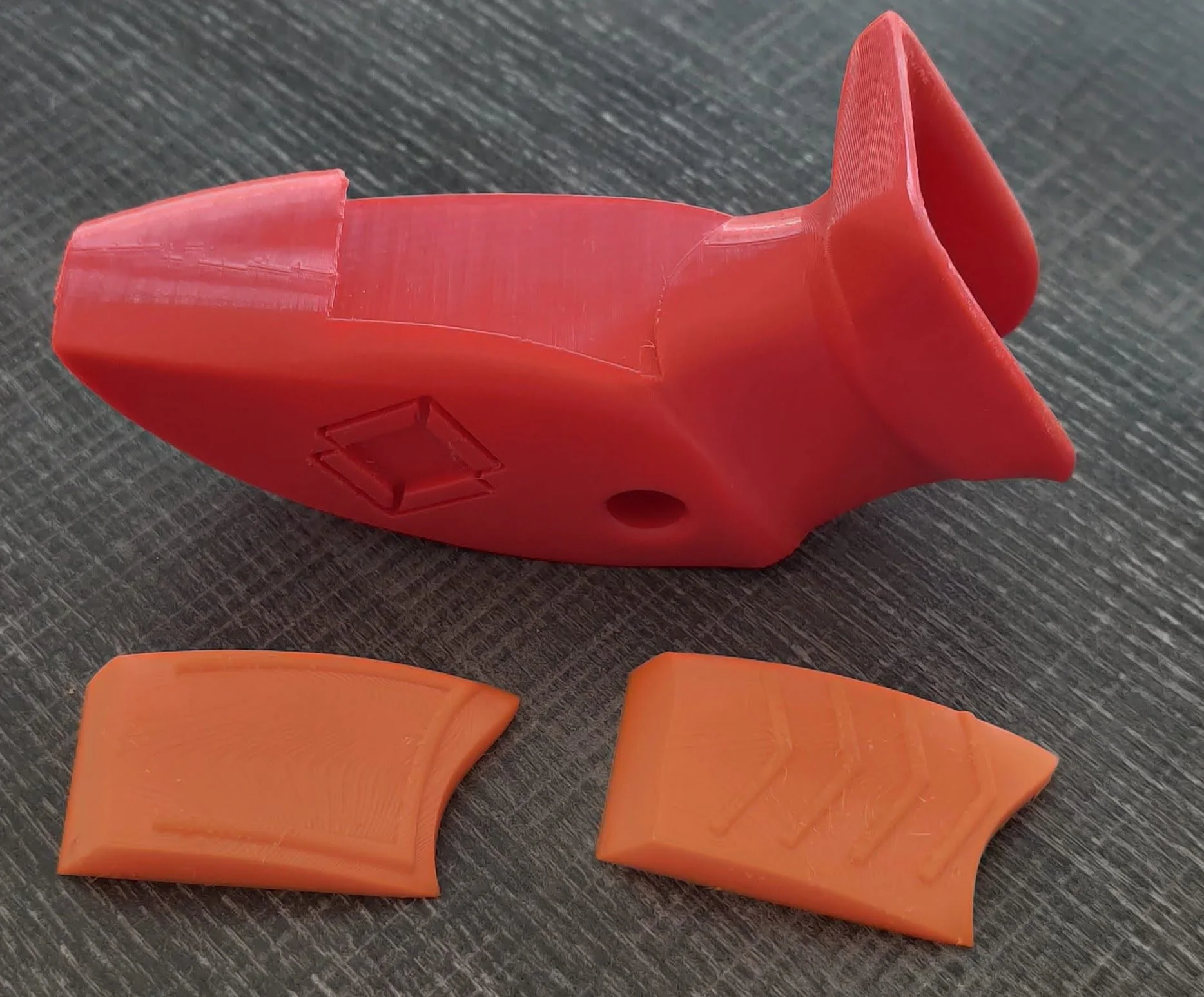 Modular Palm Grip design to allow for different traction patterns at the pressure point.  Customized to the feel the archer is looking for.