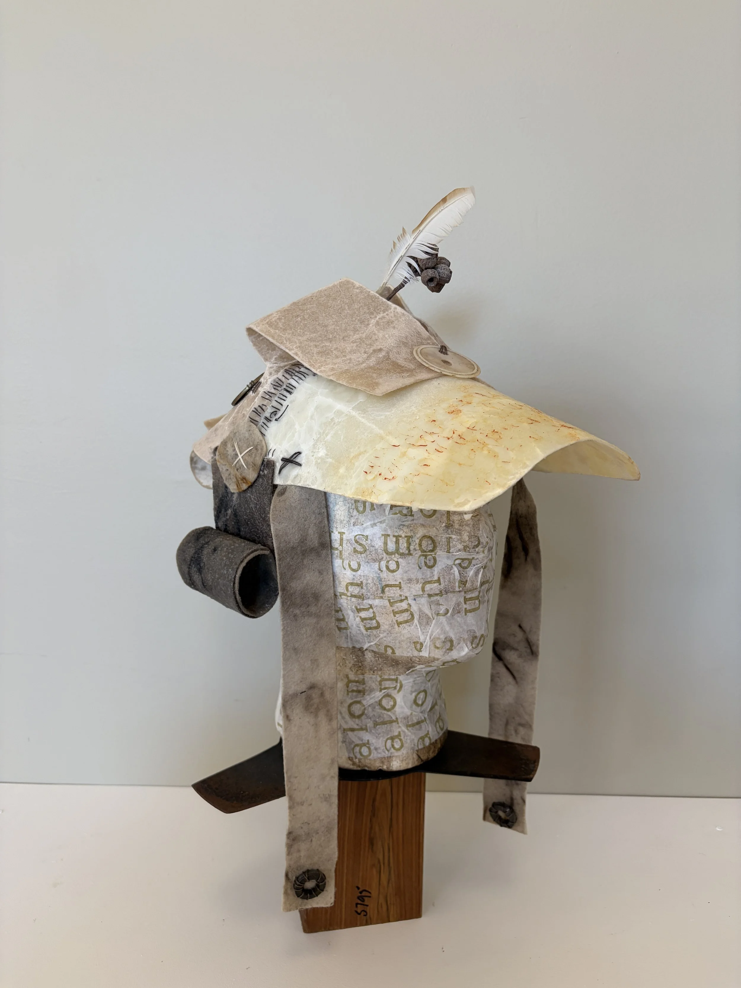 Angel of the South
Inspired by the armour of God that Paul describes in his letter to the church at Ephesus, "Breastplate and helmet" explores the intersection of material memory, language, and protection. Constructed from cloth, natural fibres, and 