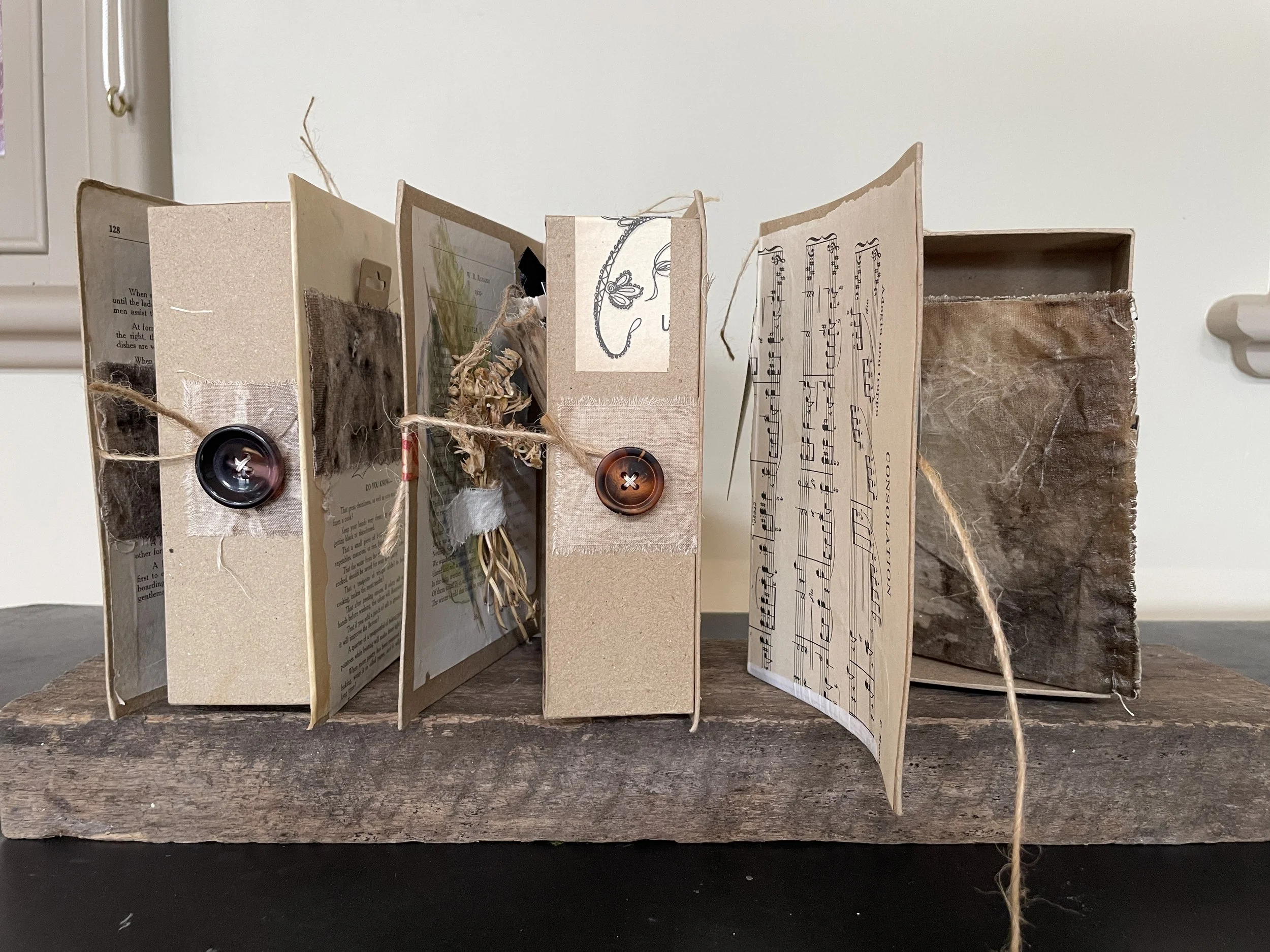 Three book-like forms hold fragments and memories of my father, mother and sister. Layered papers, fabric, photographs and personal traces honour the particular presence of each life. Together, they explore grief and the quiet degrees of consolation 