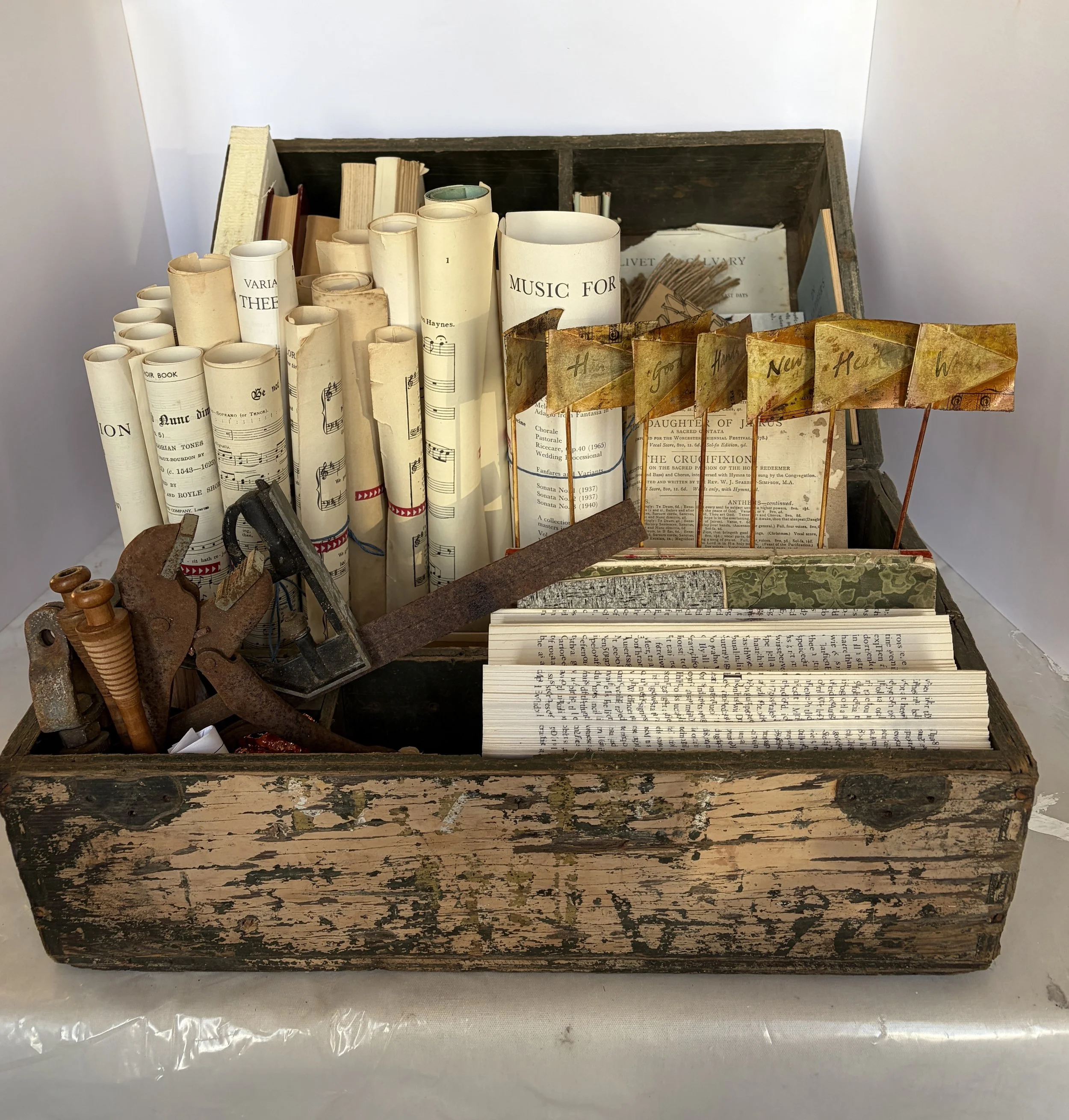 The work celebrates the physicality of books—the folding, stitching, cutting, binding and handling that lie behind the finished object. Reimagined and rearranged, these worn and forgotten materials become a playful tribute to craftsmanship, memory an
