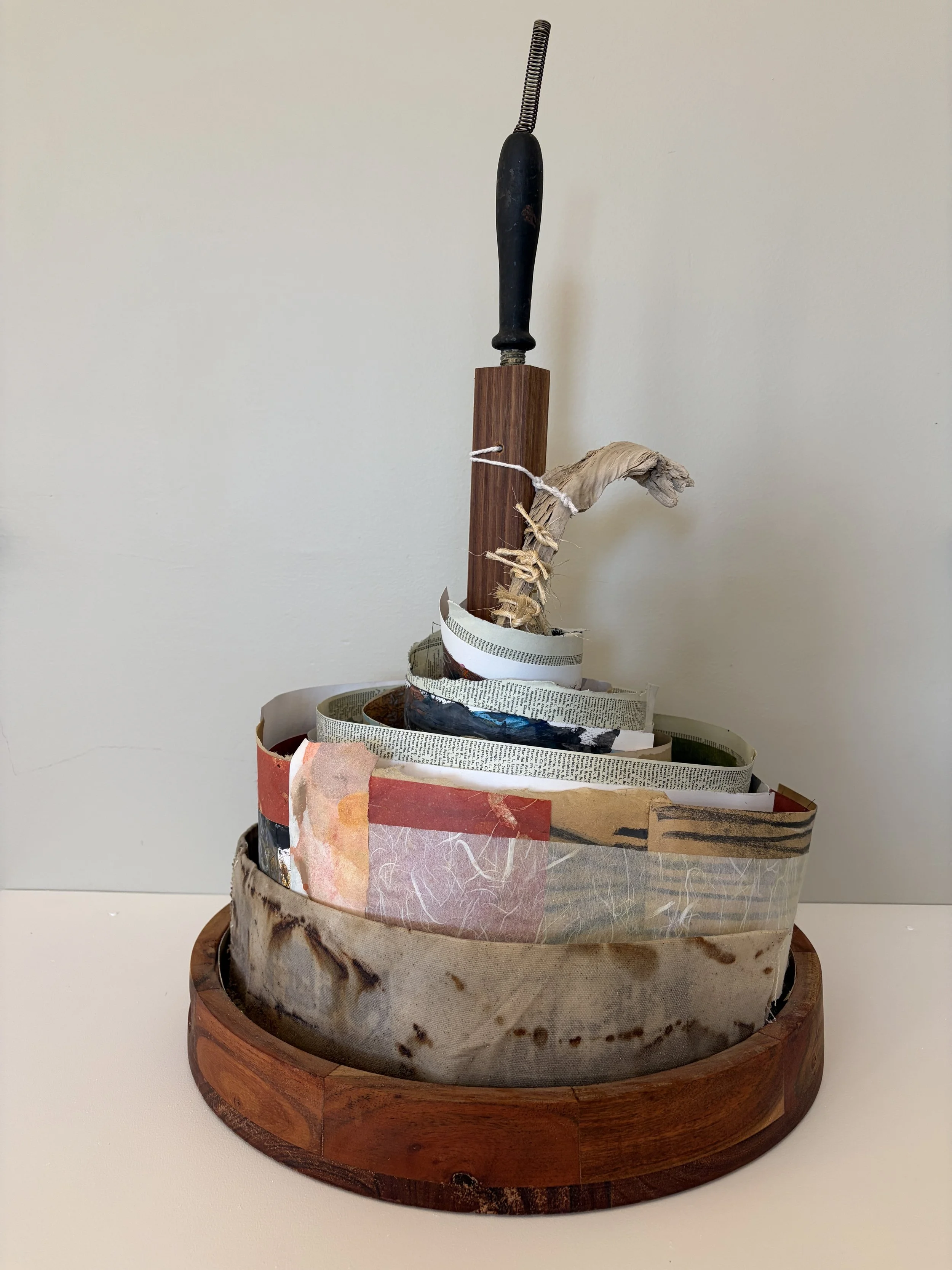 Turn and return embodies the cyclical nature of not only memory, knowledge, and creation but our repeated need to say sorry and embrace a new and hope-filled direction. Constructed from layered and coiled materials — papers, textiles, fragments of te