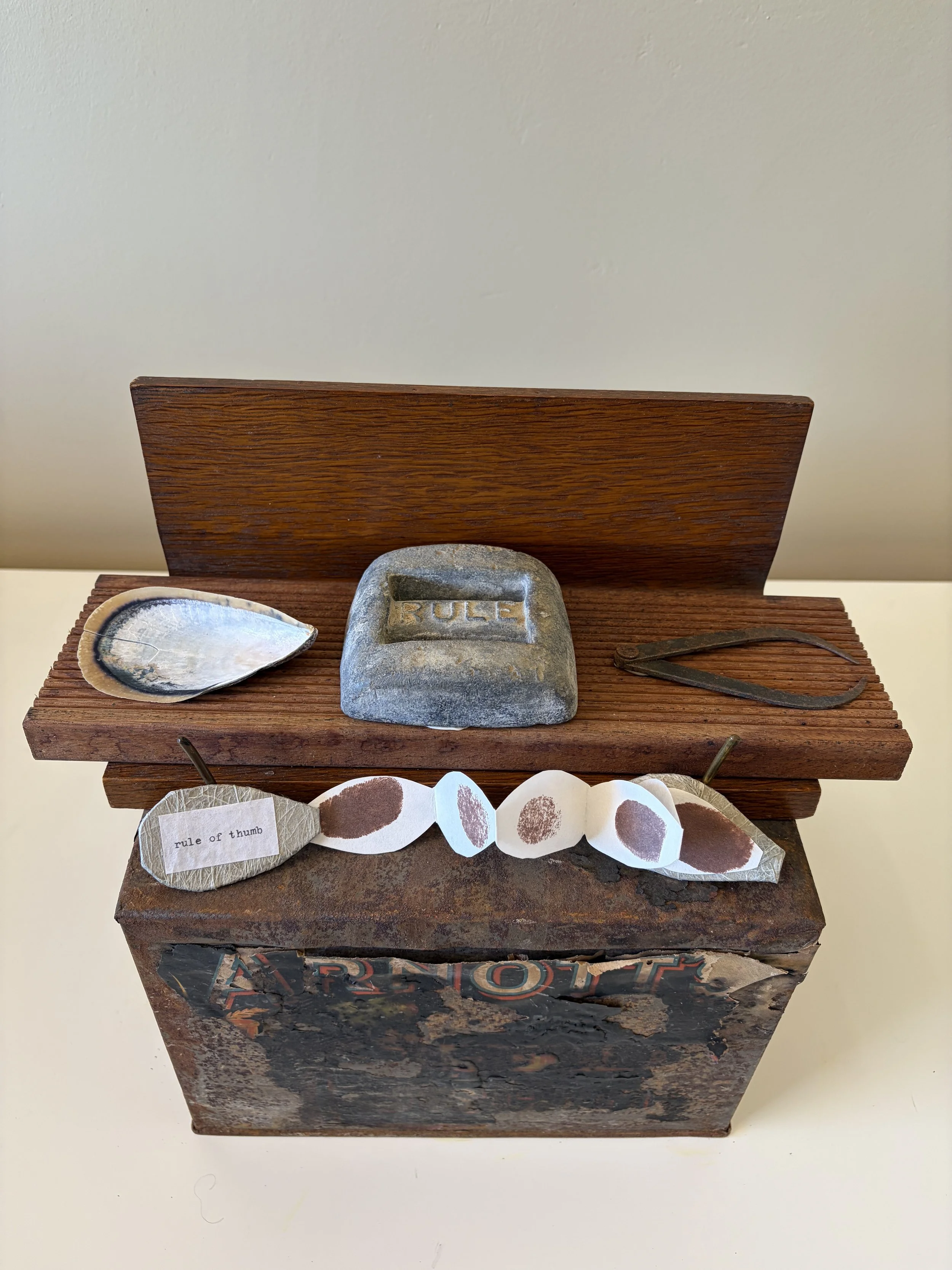 Rule of Thumb explores the ways we measure, judge and make sense of the world. A collection of objects alongside a small unfolding book of thumbprints. The work plays with the familiar phrase “rule of thumb”, suggesting the tension between precise me