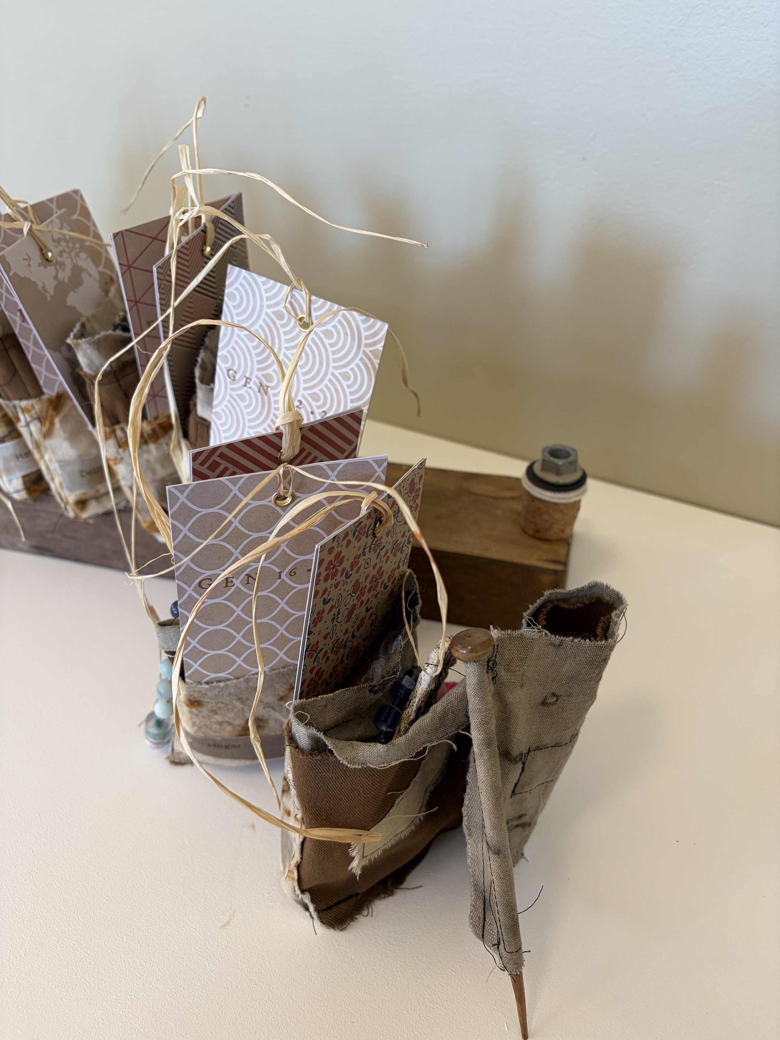 Women's prayer group
This work examines themes of women in gathered community, memory, and the handmade archive. Composed of a series of small, vessel-like forms arranged in a row, the piece evokes a collective presence — a gathering of individuals, 