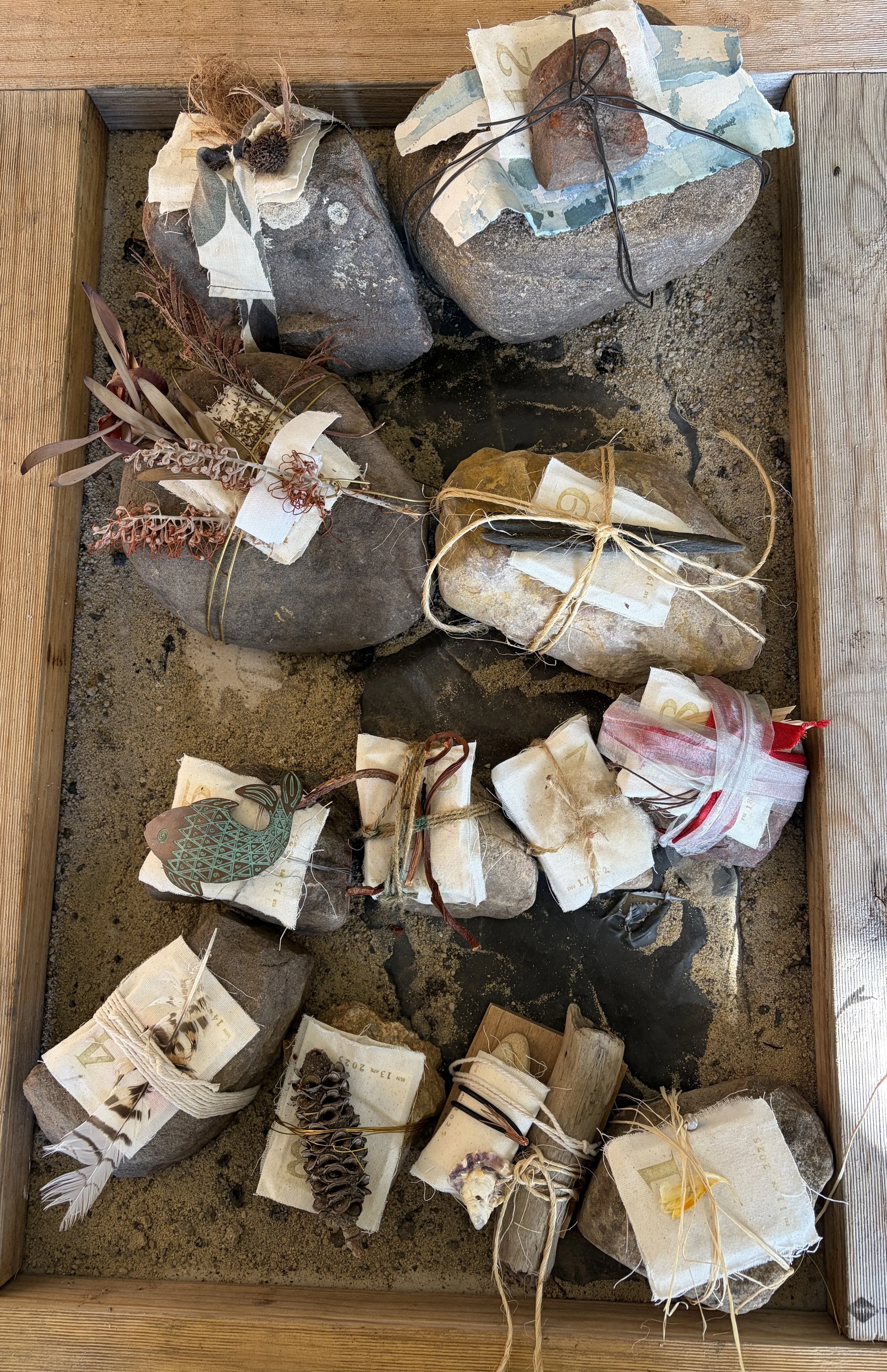 12 Days of Prayer
Created during the twelve days leading to Good Friday, this work traces Christ’s journey towards the crucifixion. Stones gathered from our paddocks carry small, canvas-covered books, bound with wire and string. Each becomes a place 