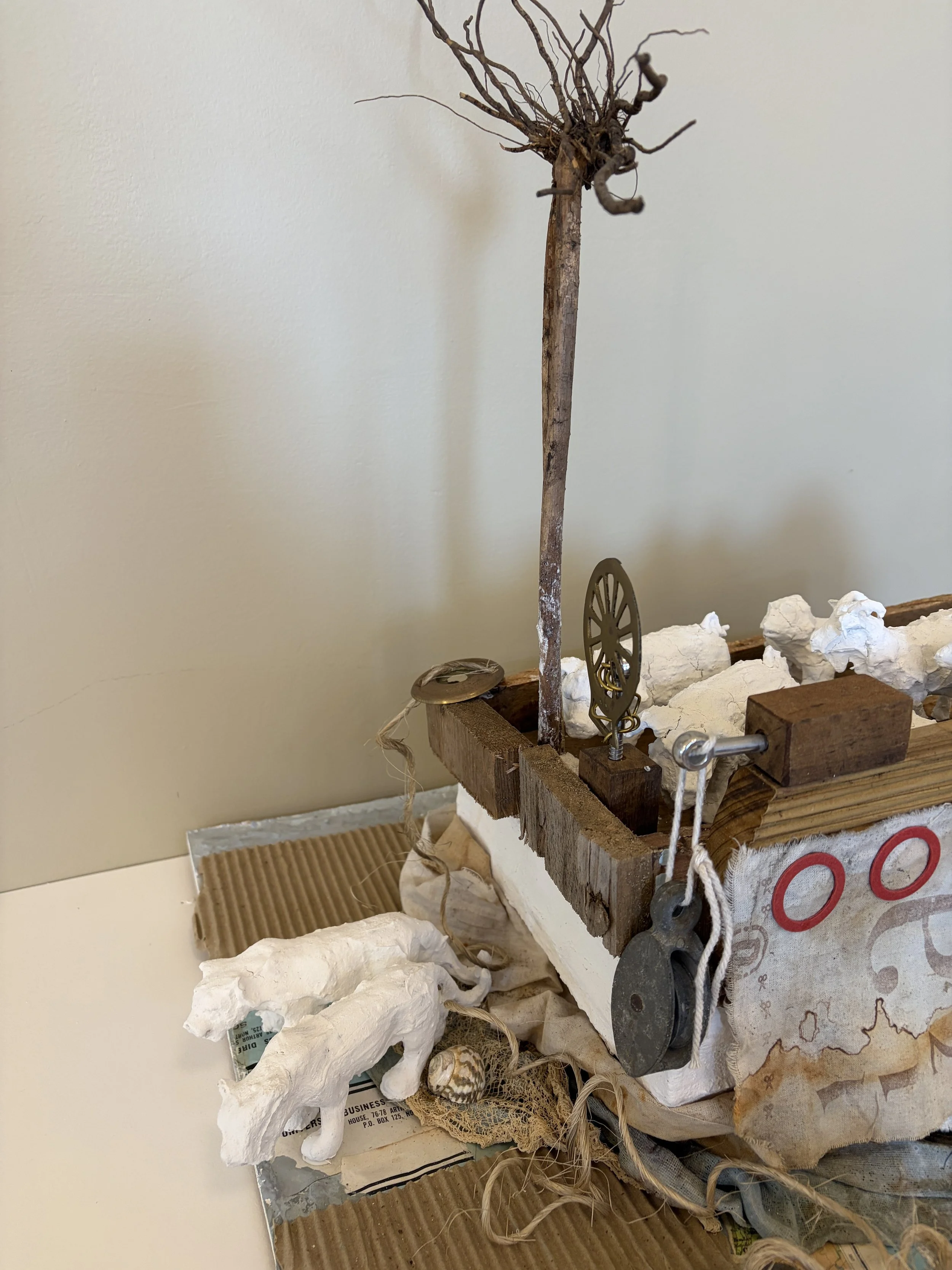 Ship of fools
A crowded flock travels aboard a makeshift vessel assembled from discarded timber, maps, fabric and mechanical fragments. Ship of Fools reflects on our uncertain passage through a world burdened by human folly—each passenger following t