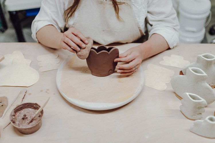 Students working on pottery at a Fleur workshop