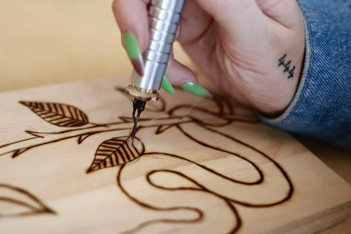 A wood burned design up close