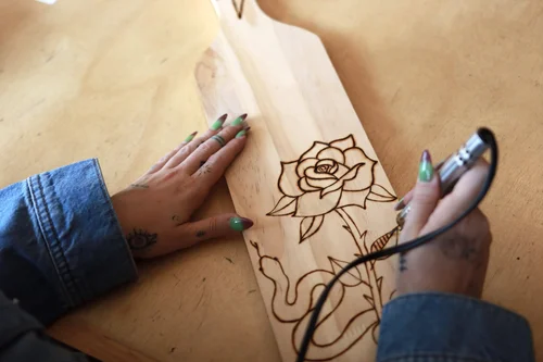 Wood burning a design onto a board