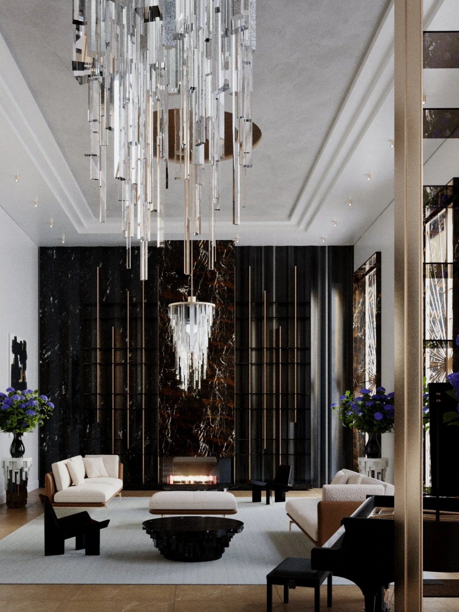 Modern living room with plaster ceiling, two large crystal chandeliers, black wall with fireplace, and black and white armchairs around a black table, with vases of purple flowers.