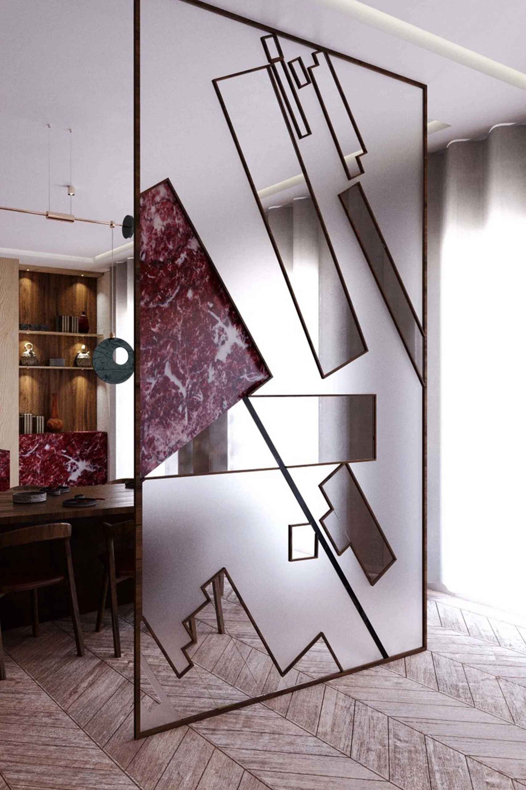 Une séparation en métal avec des sections en marbre rouge et des formes géométriques dans un intérieur moderne.
