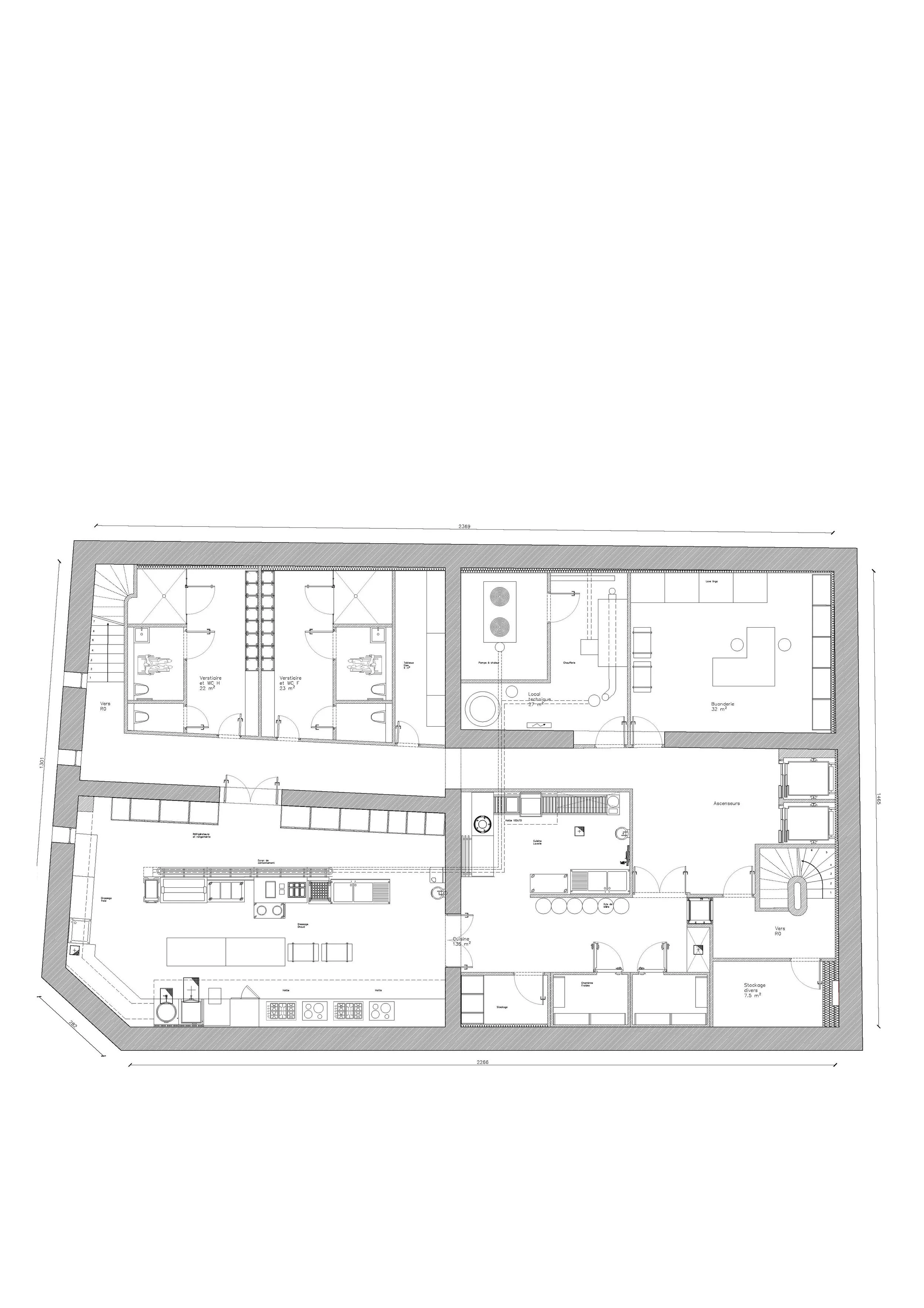 Architectural plan of a building with various rooms, including kitchens, bedrooms, bathroom, living room, staircase and storage areas.